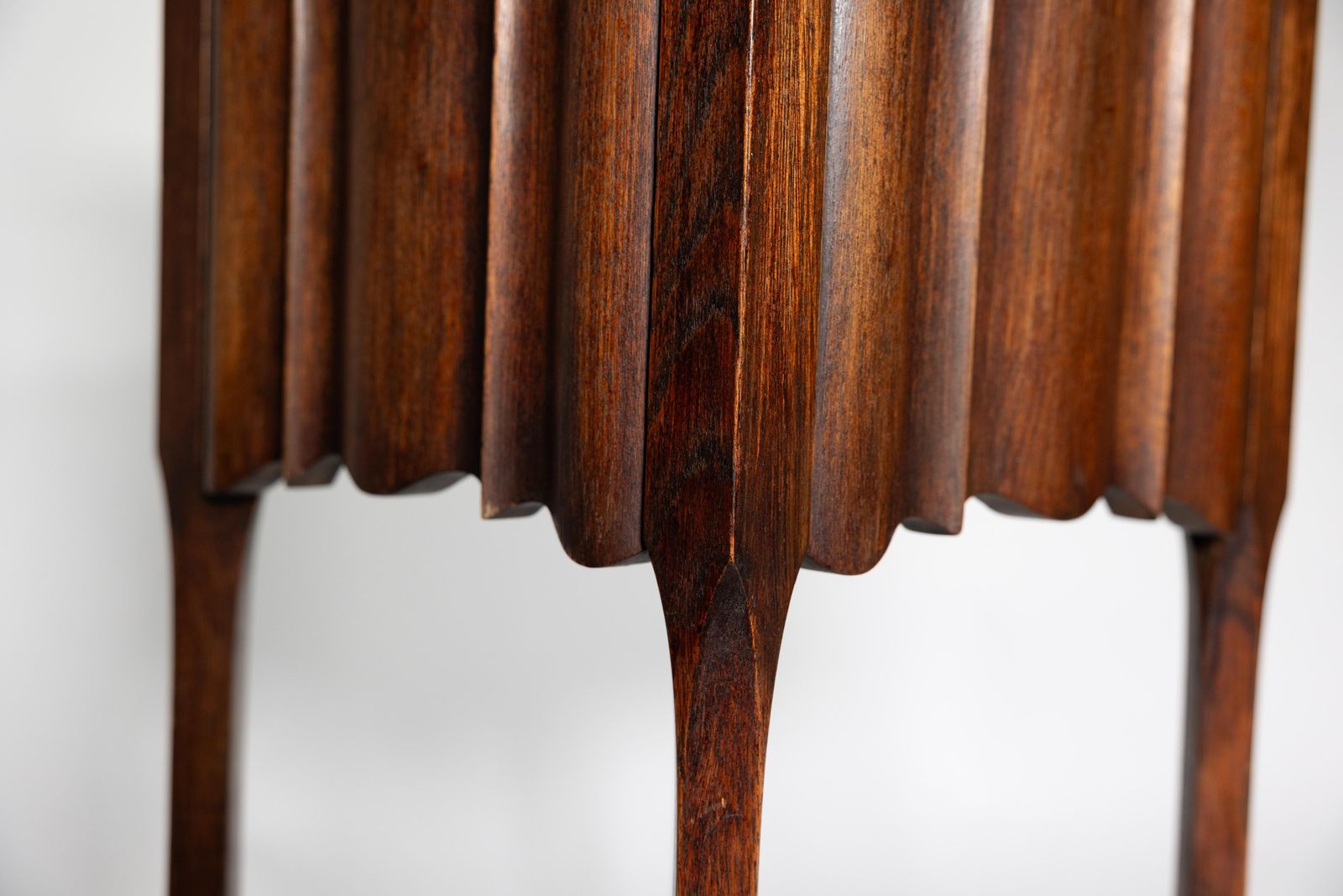 1428.0 An Arts And Crafts Walnut Plant Stand With A Shaped Top And Ribbed Style Sides photo