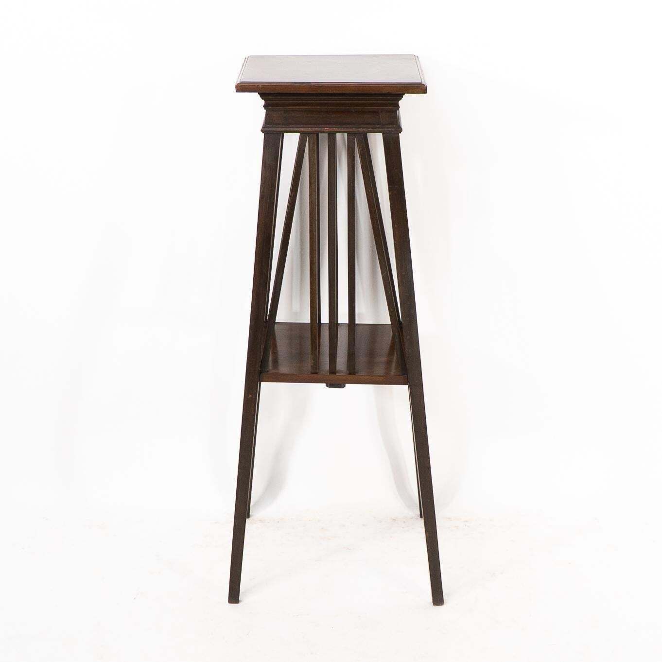 Liberty & Co In The Style Of E W Godwin. An Anglo Japanese Two Tier Plant Stand photo furniture