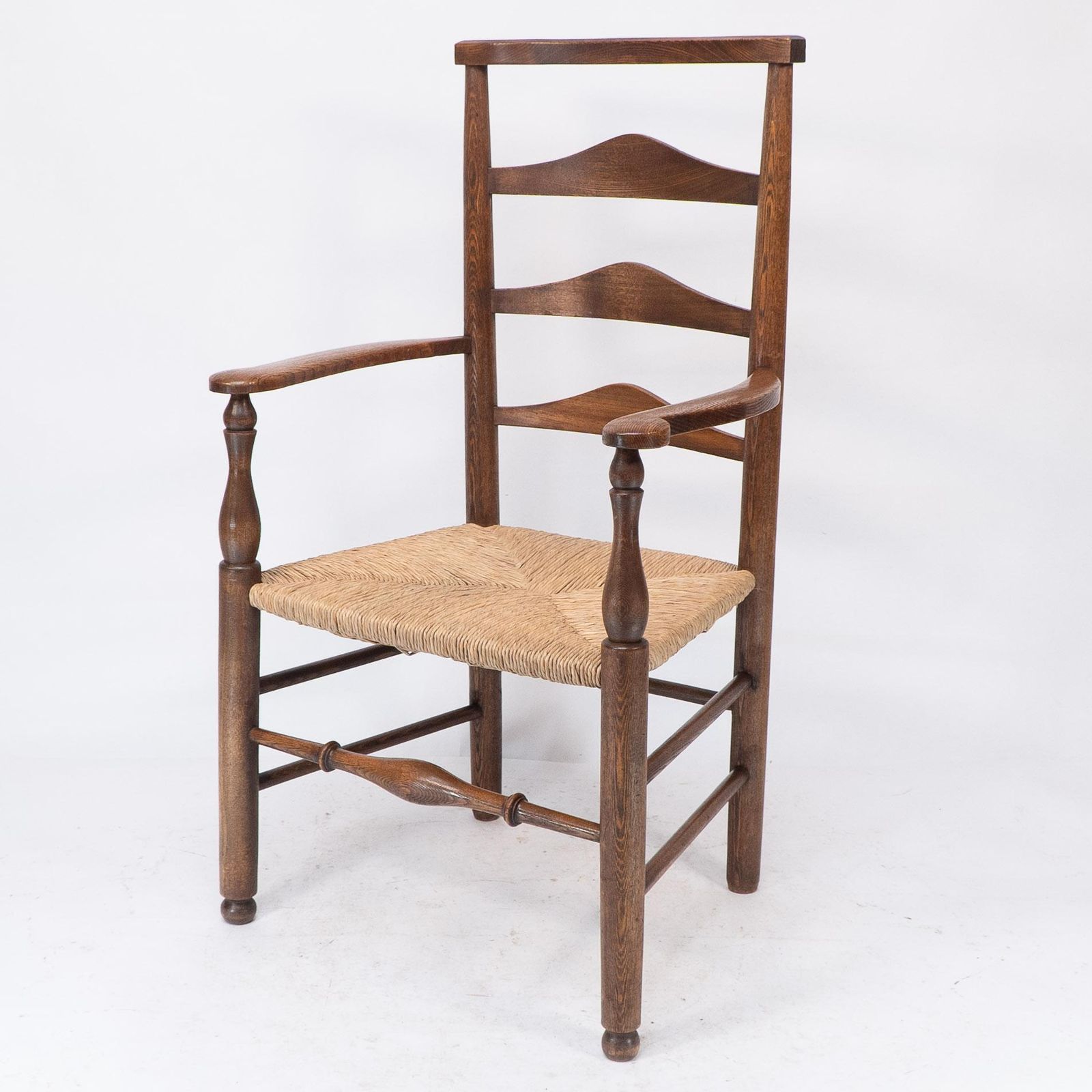 C R Ashbee Attr. An Arts & Crafts Oak Ladder Back Armchair With Re Rushed Seat photo for sale