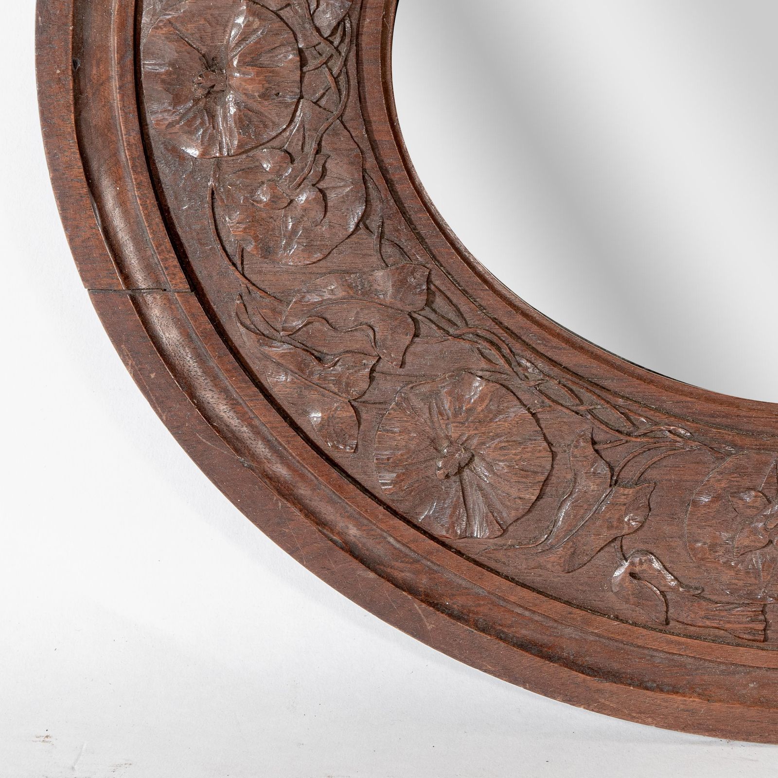 An Arts & Crafts Walnut Circular Mirror With Stylized Floral Carved Decoration photo vintage