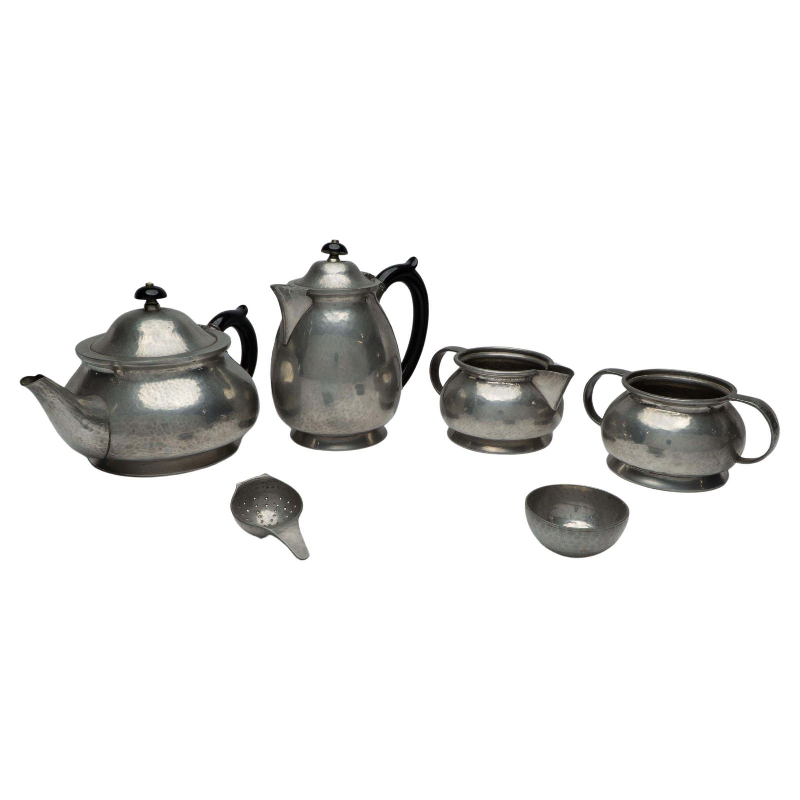 Liberty And Co. An Arts And Crafts Six Piece Pewter Tudric Tea Set