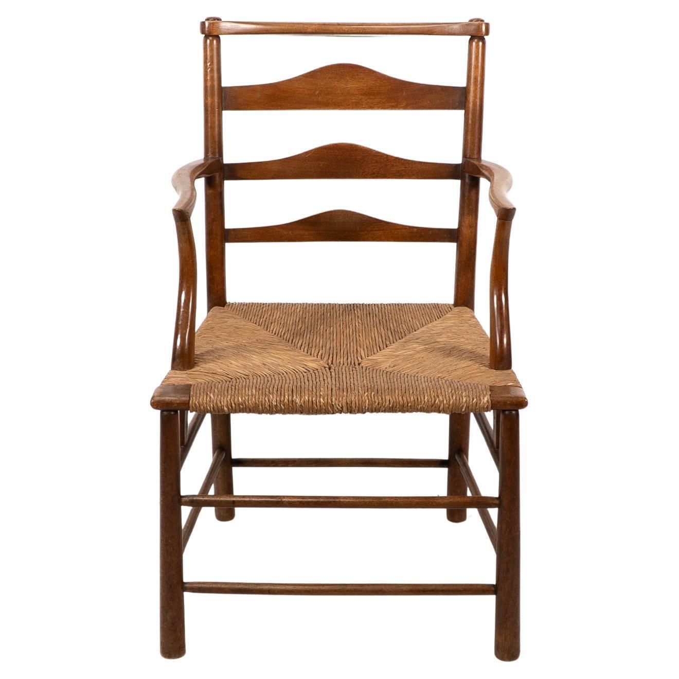 C R Ashbee. An Arts And Crafts Rush Seat Ladder Back Armchair photo furniture