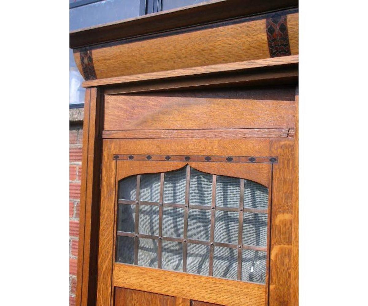 Gillows. An Arts & Crafts Oak Treble Wardrobe With Ebony Floral Inlays photo for sale