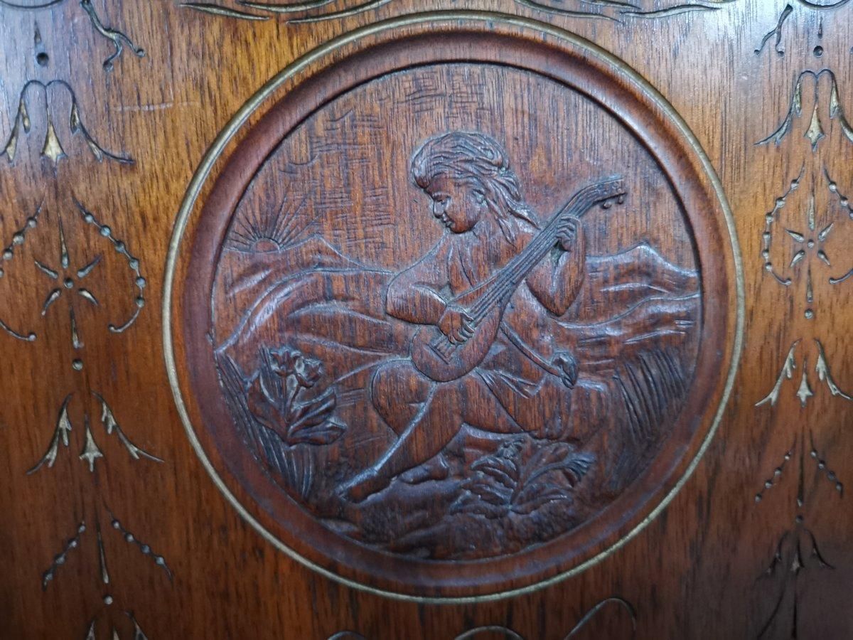 photo furniture Aesthetic Movement Side Cabinet With Carved Panels Of Putti Putti Playing Music.