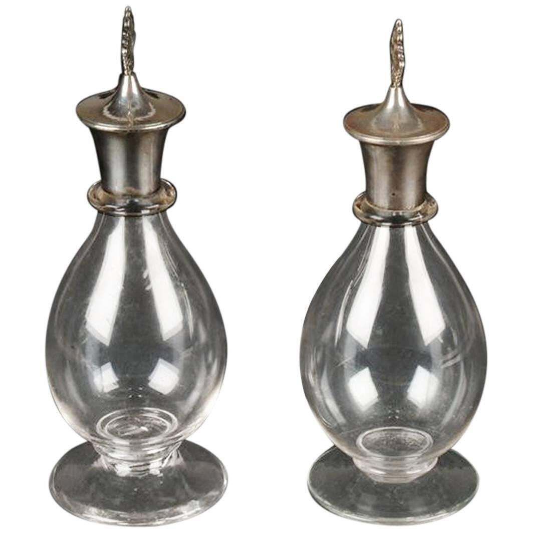 Greenwood And Watts. A Pair Of Gothic Revival Silver Mounted Glass Decanters.
