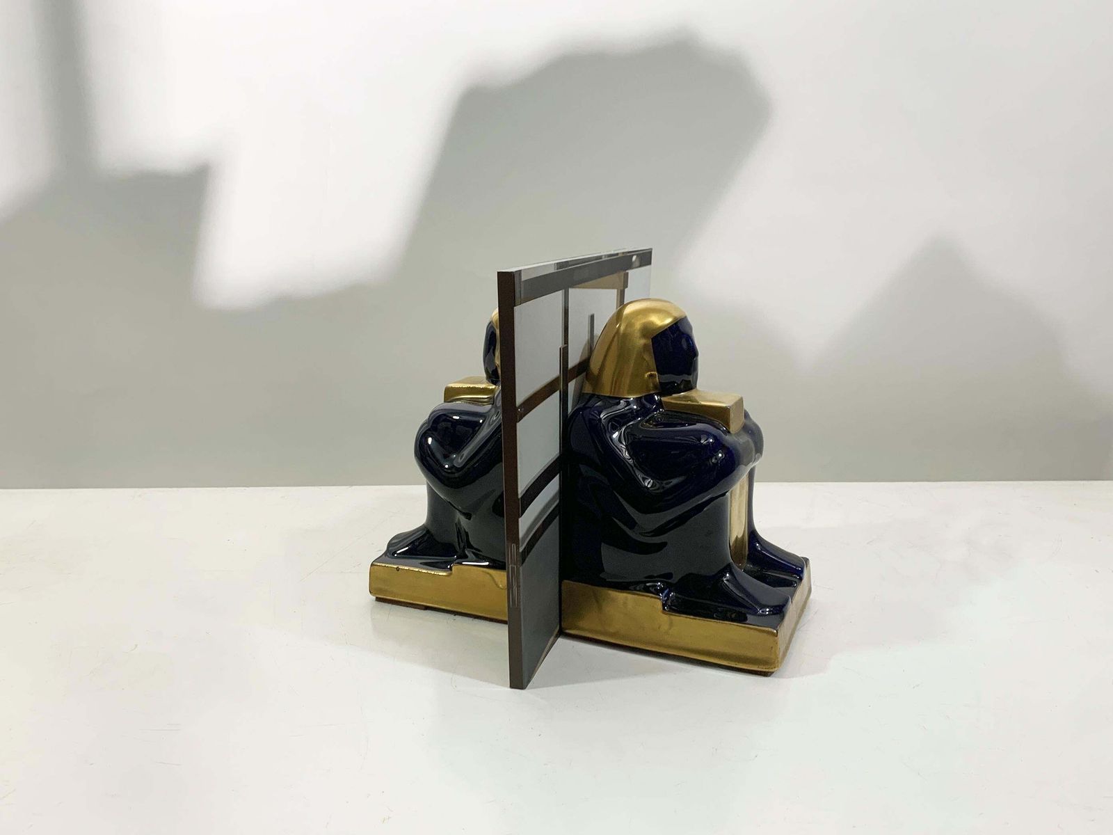 photo buy Mid 20th Century French Egyptian Revival Ceramic Bookends In Deep Navy/Goldcolor