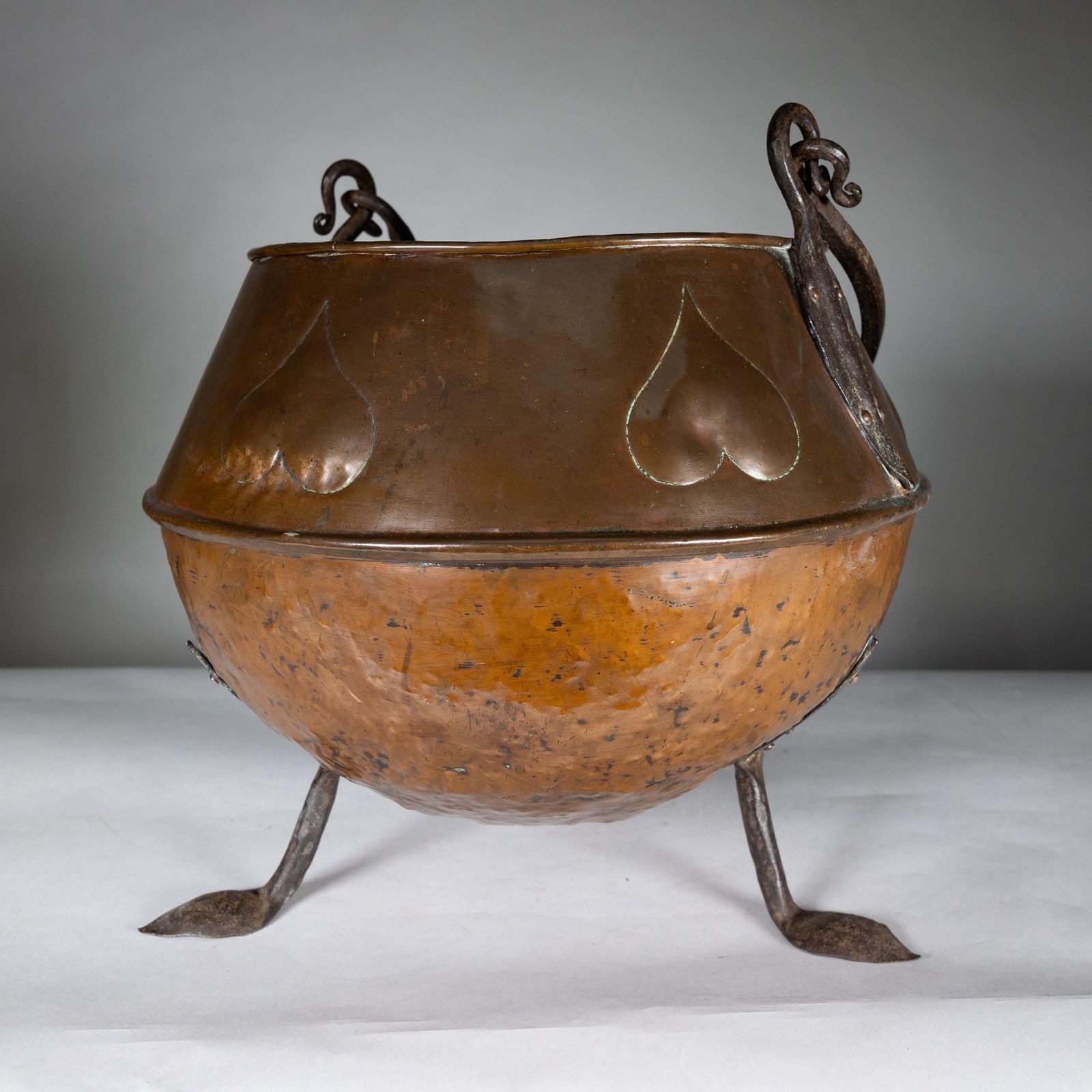 An Arts And Crafts Copper Coal Bucket With Stylized Heart Decoration photo furniture