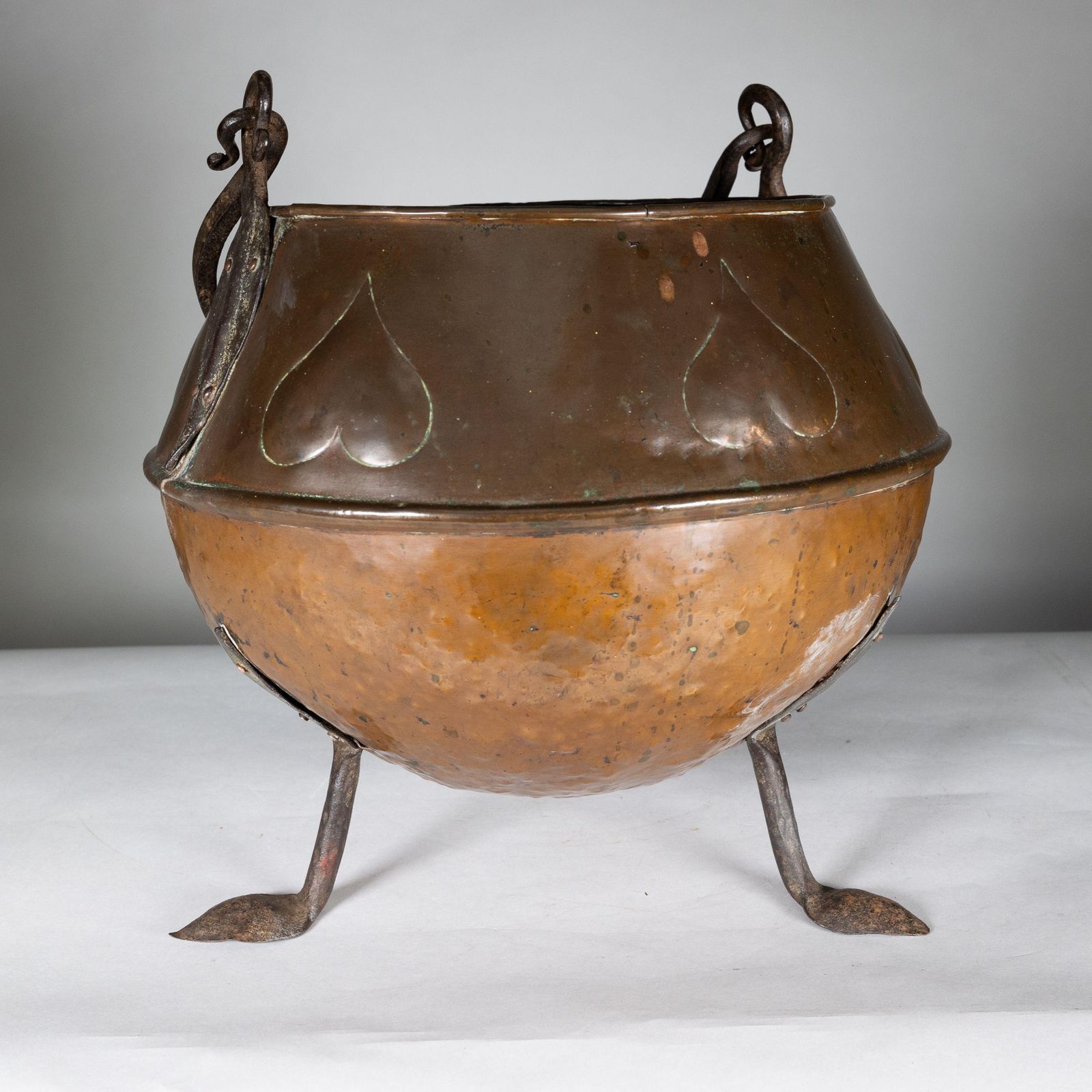 An Arts And Crafts Copper Coal Bucket With Stylized Heart Decoration photo 375.0