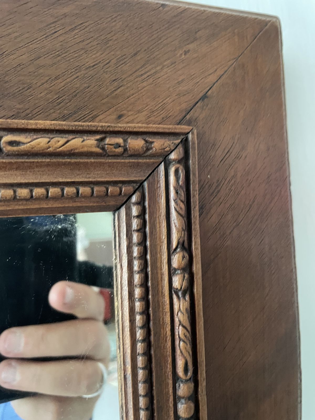French Carved Cherry Wood Mirror With A Patterned Frame Featuring Beaded And Entwined Ribbon Detail. photo vintage