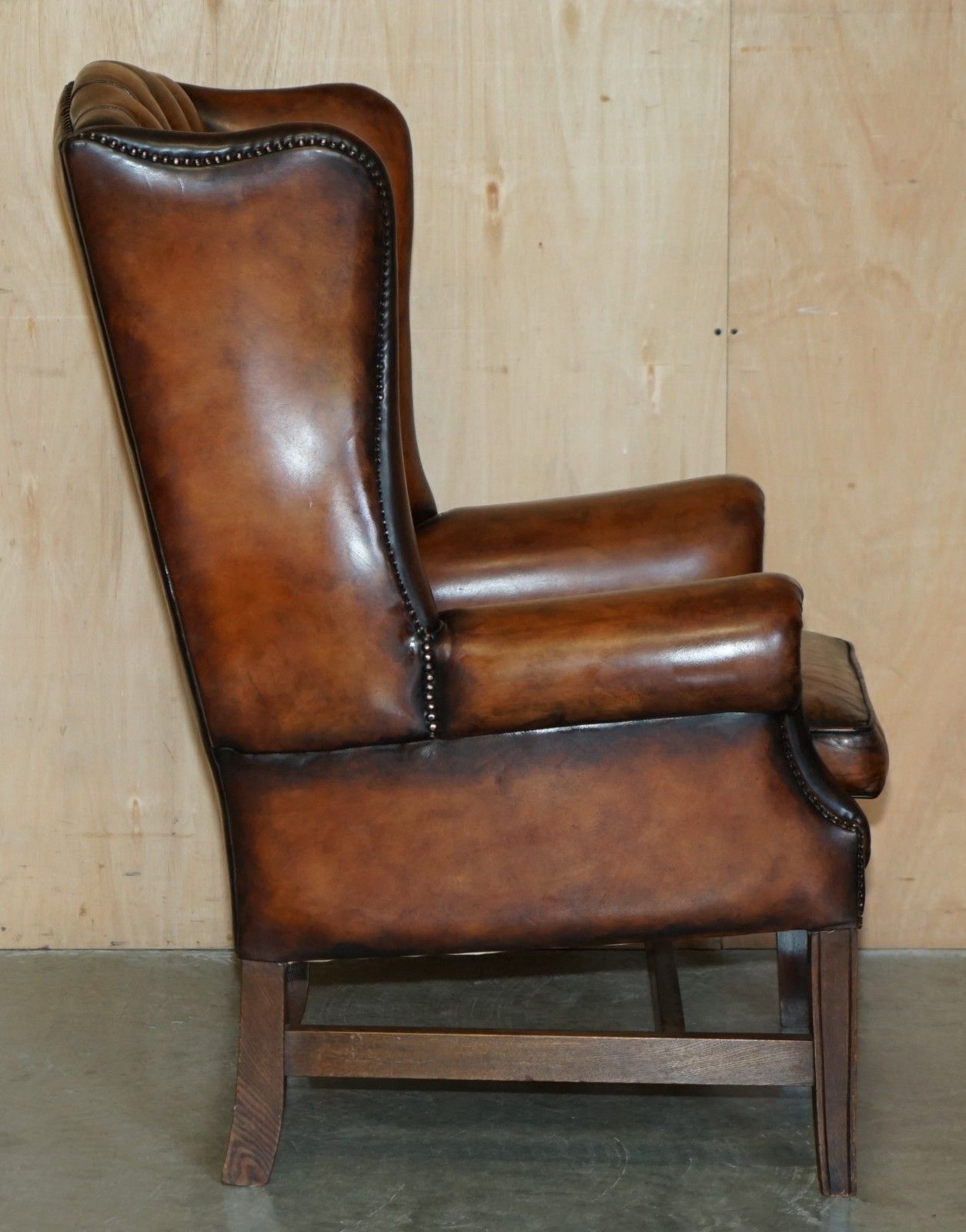 photo vinterior Comfortable Restored Whiskey Brown Leather Tufted Chesterfield Wingback Armchair