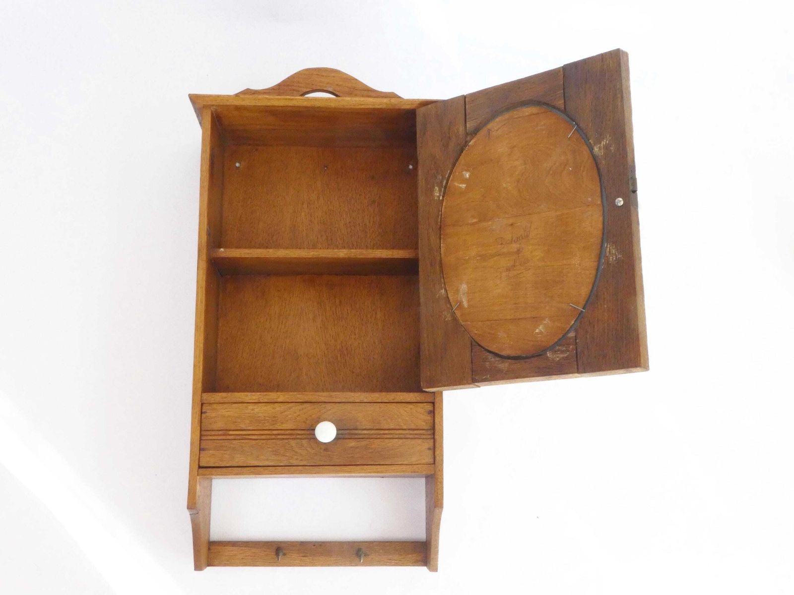 photo furniture Small Antique Wooden Hanging Cabinet With Oval Mirror And Carved Floral Details, Medicine Apothecary With Drawer And Shelf