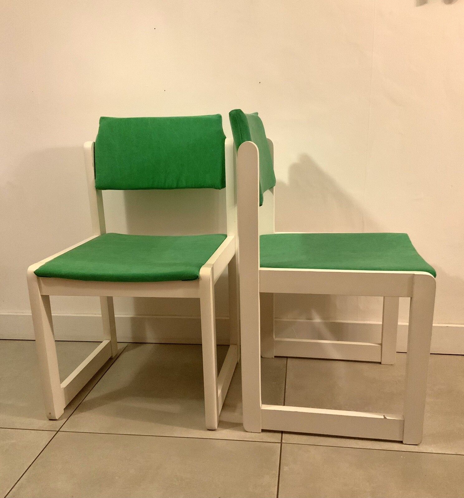 A Pair Of White Mid Century German Dining Chairs With Green Reupholstery photo furniture