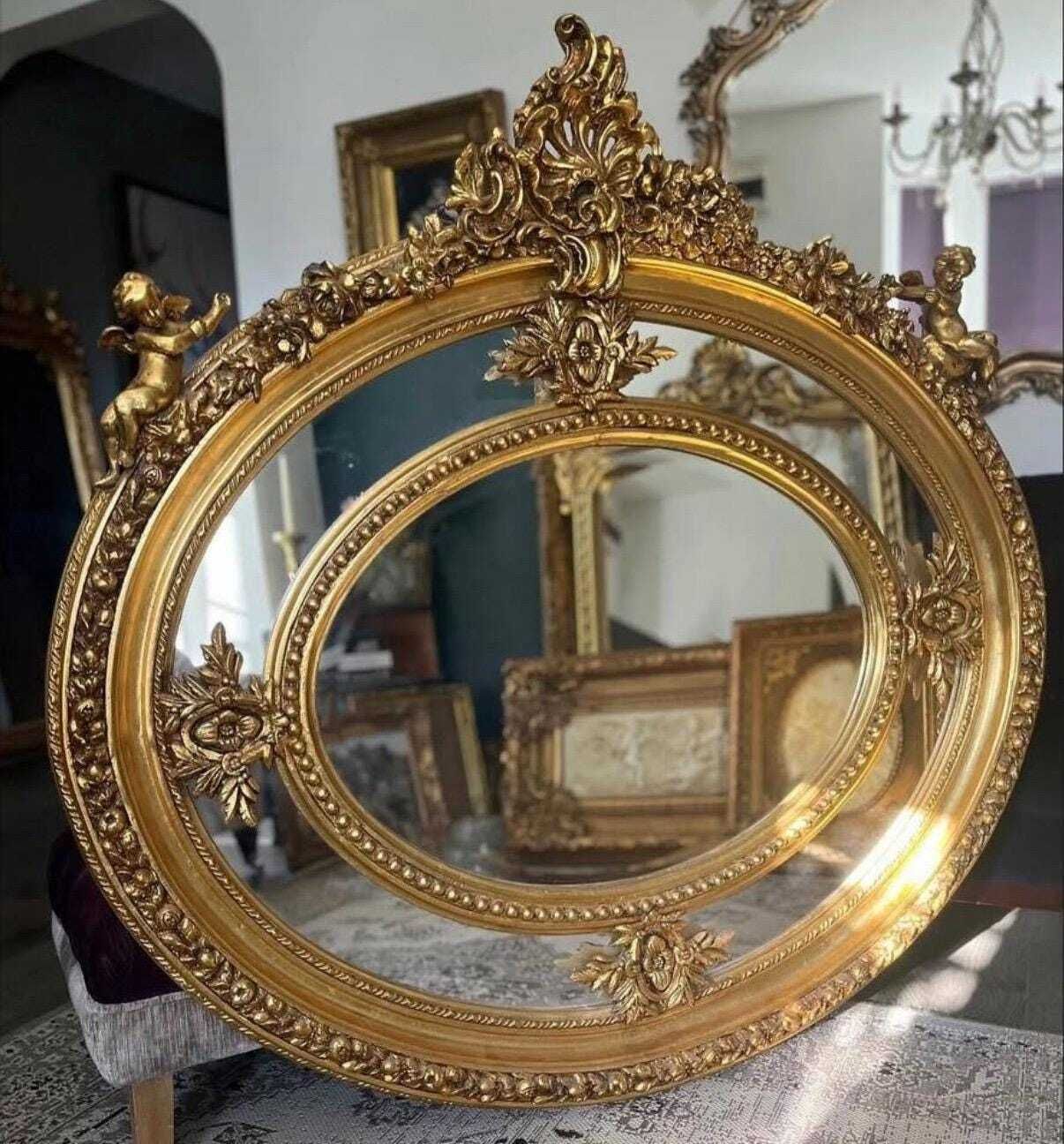 Beautiful French Oval Shaped Highly Carved Mirror With Cherubs, Floral Foilage