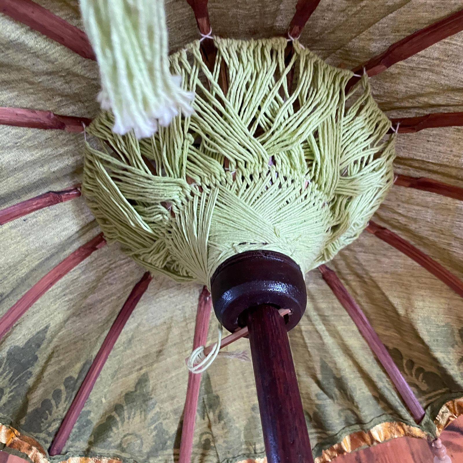 photo vinterior Balinese Green Gold Parasol Umbrella Decorative Tassel Temple Shade Stand Boho Exotic Vintage Decor Handcrafted Bali Art Wooden Base Accent