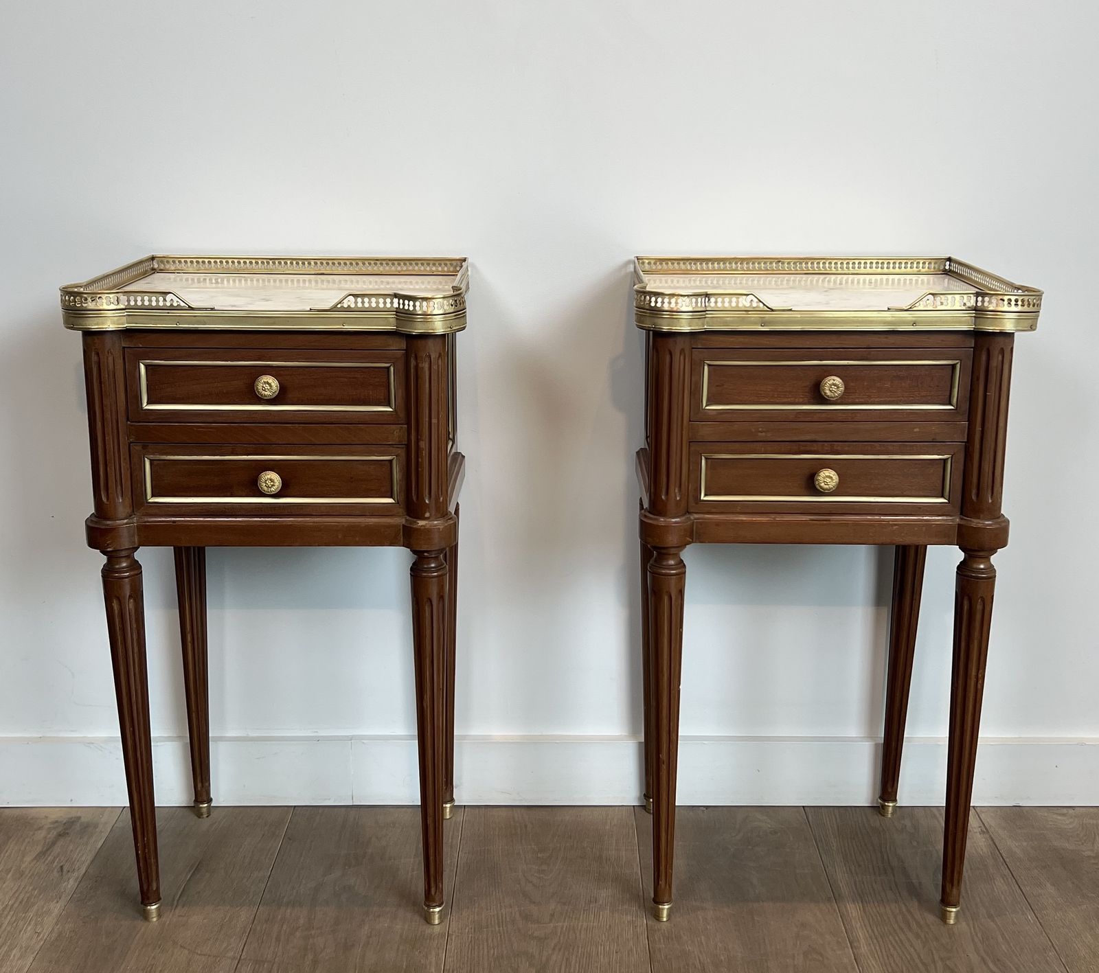 2450.0 Pair Of Mahogany And Brass End Tables Or Bedside Tables With Carrara Marble Tops In The Style Of Maison Jansen. Circa 1940 photo