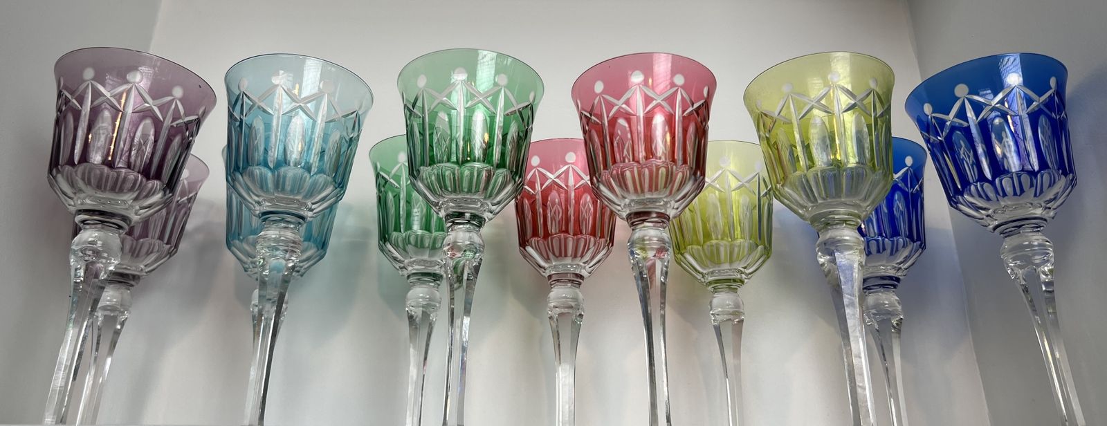 Set Of Twelve Crystal Glasses Tinted In Different Colors And Cut With Stars