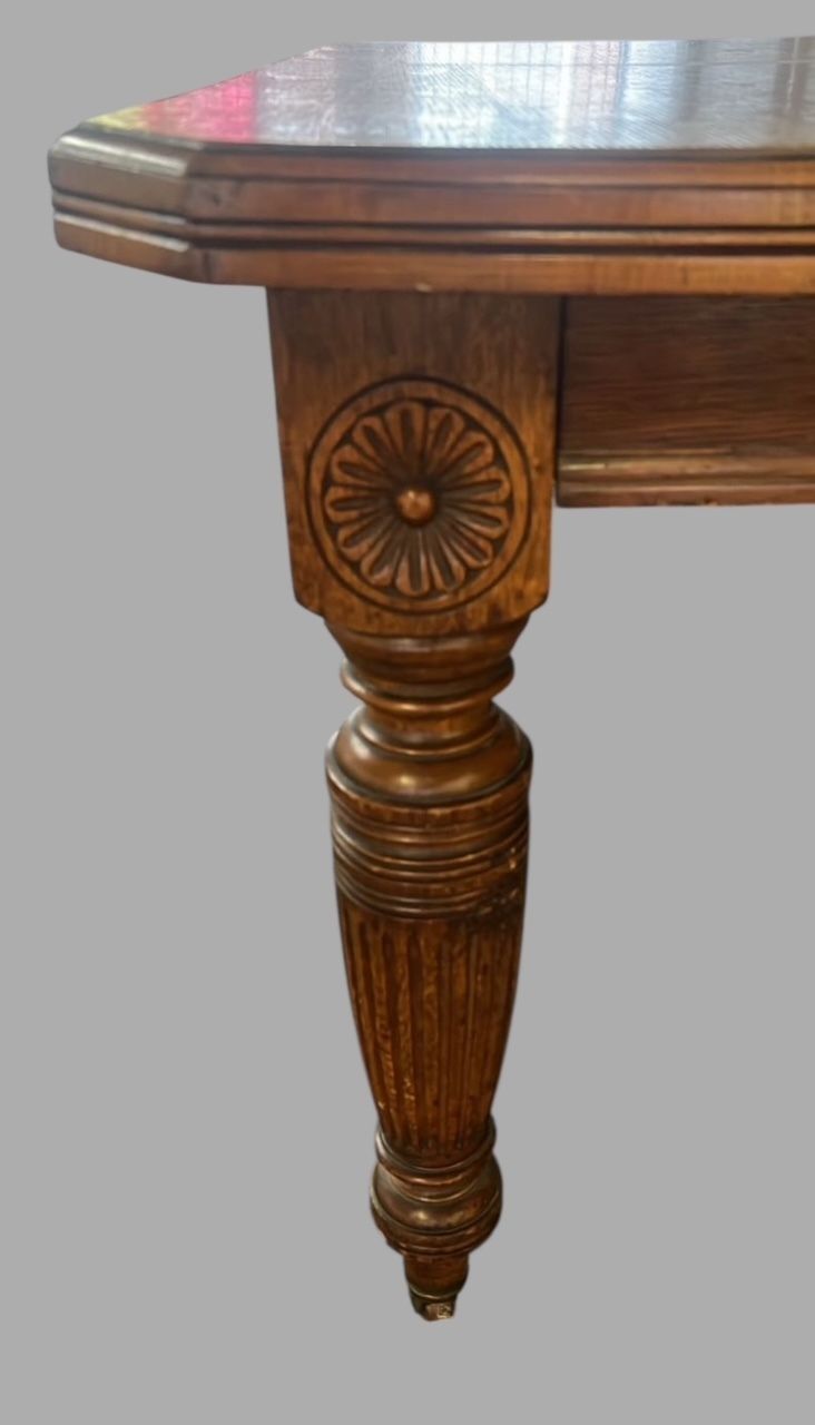 A Characterful Antique Oak Dining Table With Extending Leaves photo Furniture