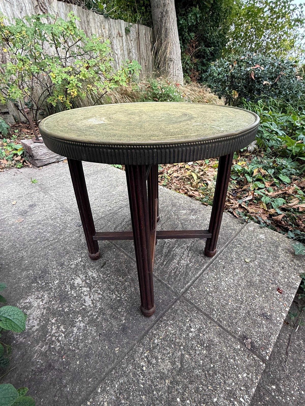 Antique 1920s Anglo Indian Brass Tray Table | Carved Hardwood Base, Folding Stand, Hand Etched Moroccan Style, Benares 1900s Folding Table photo for sale