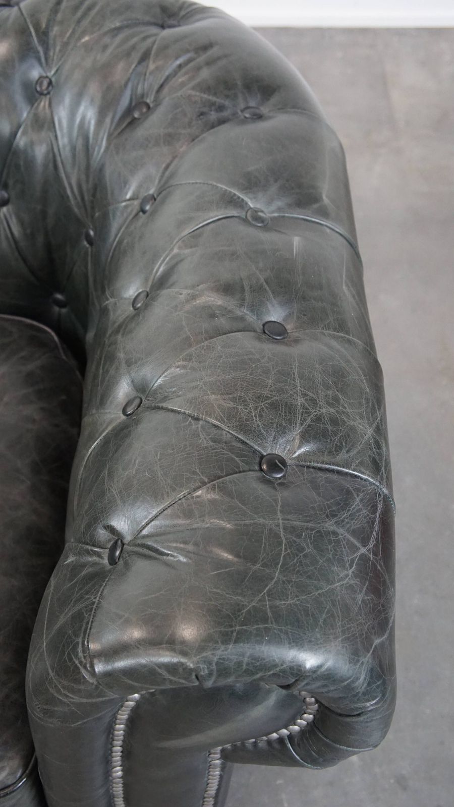 Timeless And Classic Spacious Black Chesterfield Armchair Made Of Characterful Grained Cowhide photo vintage