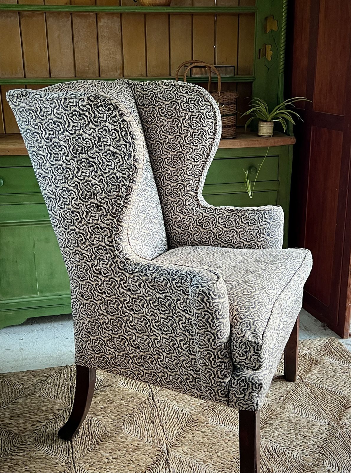 photo vintage Large Georgian Wingback Armchair, Traditionally Reupholstered In Squiggle/Seaweed Dark Blue & Natural Linwood Fabric.
