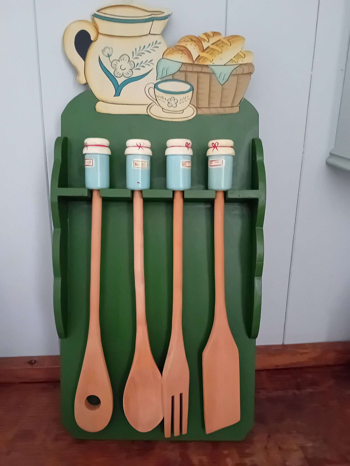 Kitchen Utensils Made Of Wood With Decorative Hanging Rack photo vintage