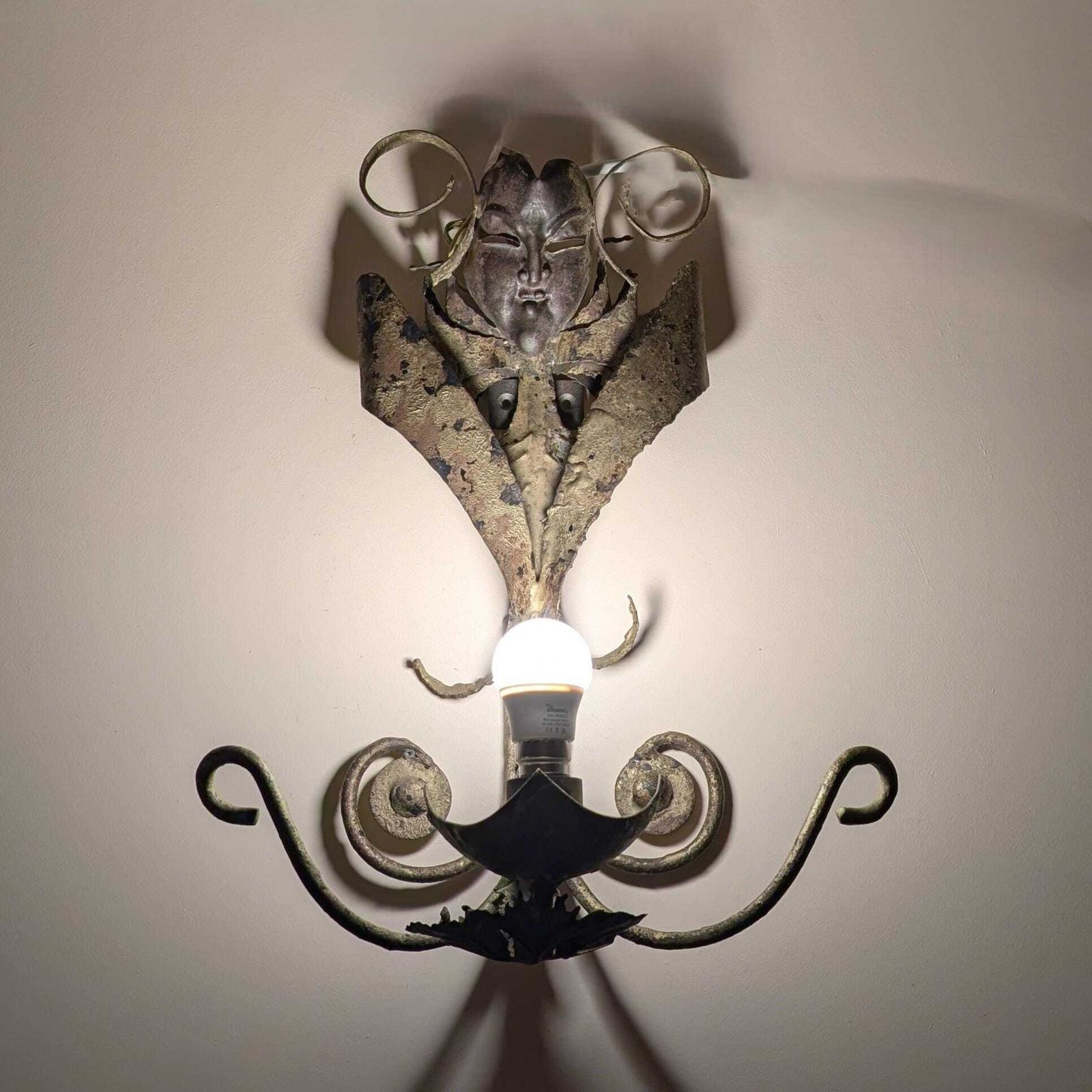 Vintage Spanish Brutalist Wrought Iron Mask Wall Sconce: Mid Century Decorative Gilt Metal Dramatic Patina Single Light Fixture From Spain photo furniture