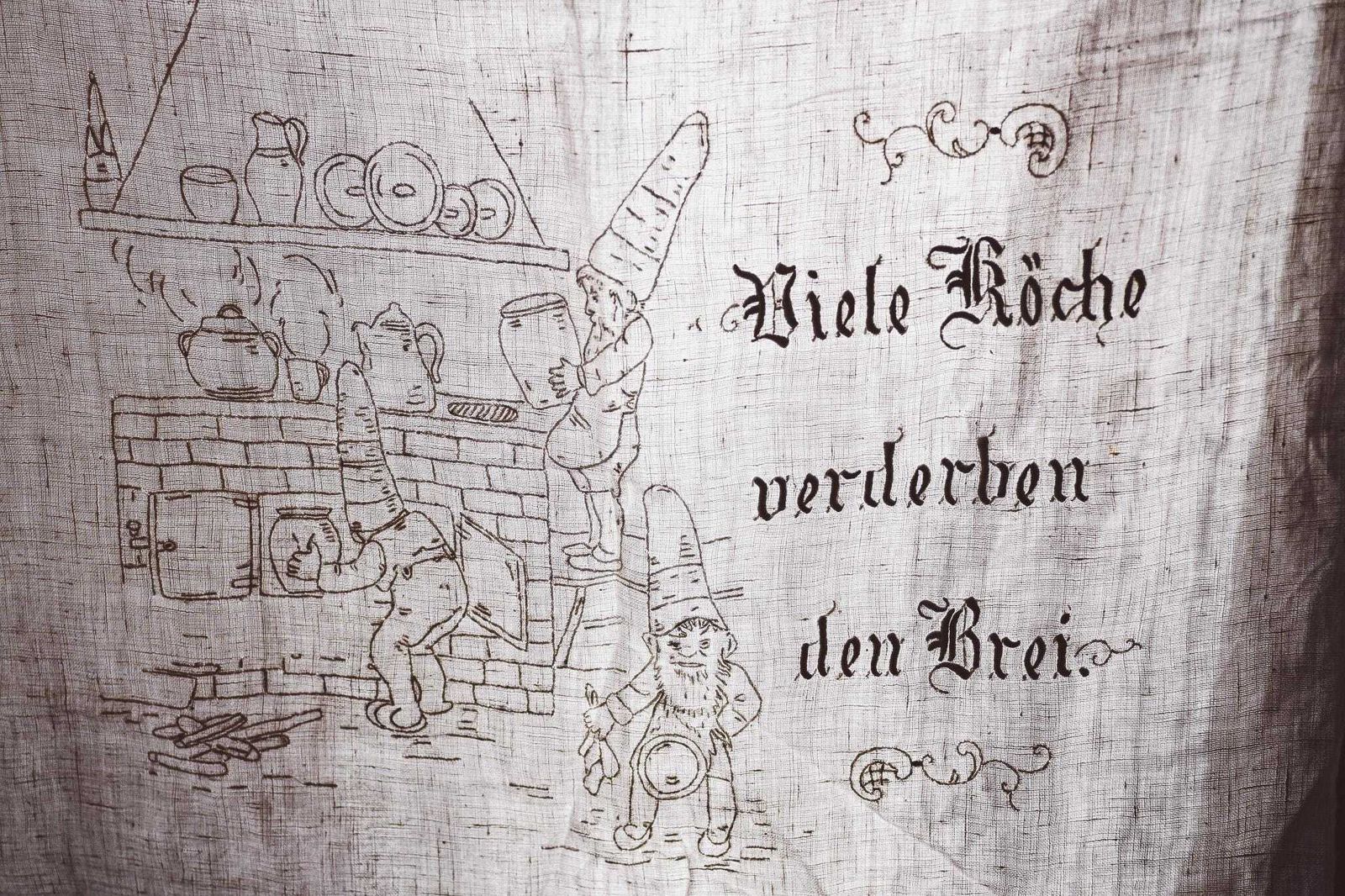 Vintage German Linen Tea Towel | Hand Embroidered Gnomes Kitchen Scene | "Viele Köche Verderben Den Brei" | 60.5x110cm