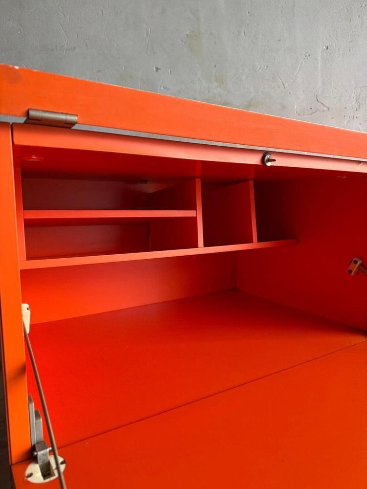 Orange Chest Of Drawers With Fold Out Work Surface And Slanted Top photo vinterior