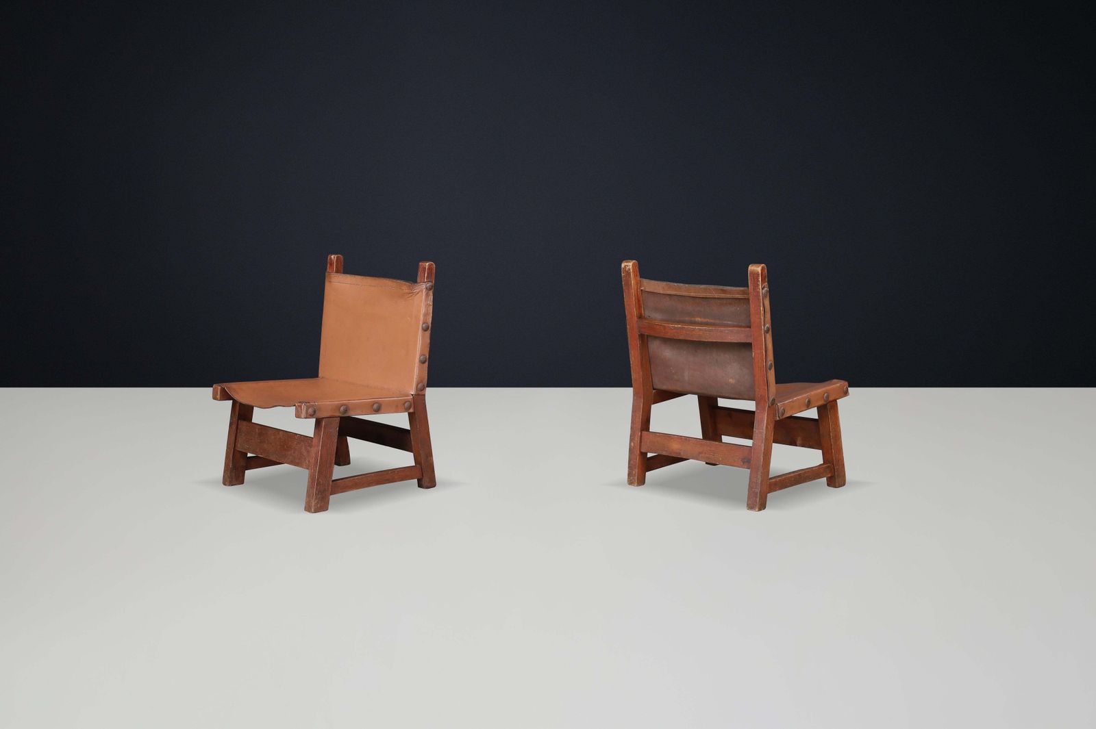 Brutalist Patinated Leather And Wood Easy Chairs, Spain, 1950s photo for sale