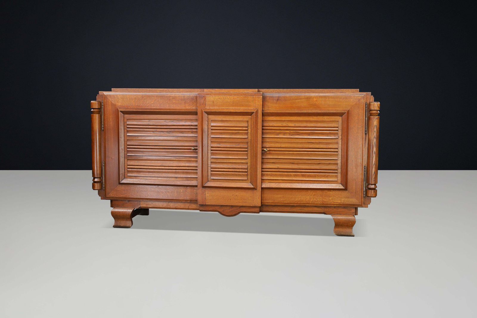 photo for sale French Art Deco Patinated Oak Sideboard With Relief Carved Doors, 1940s