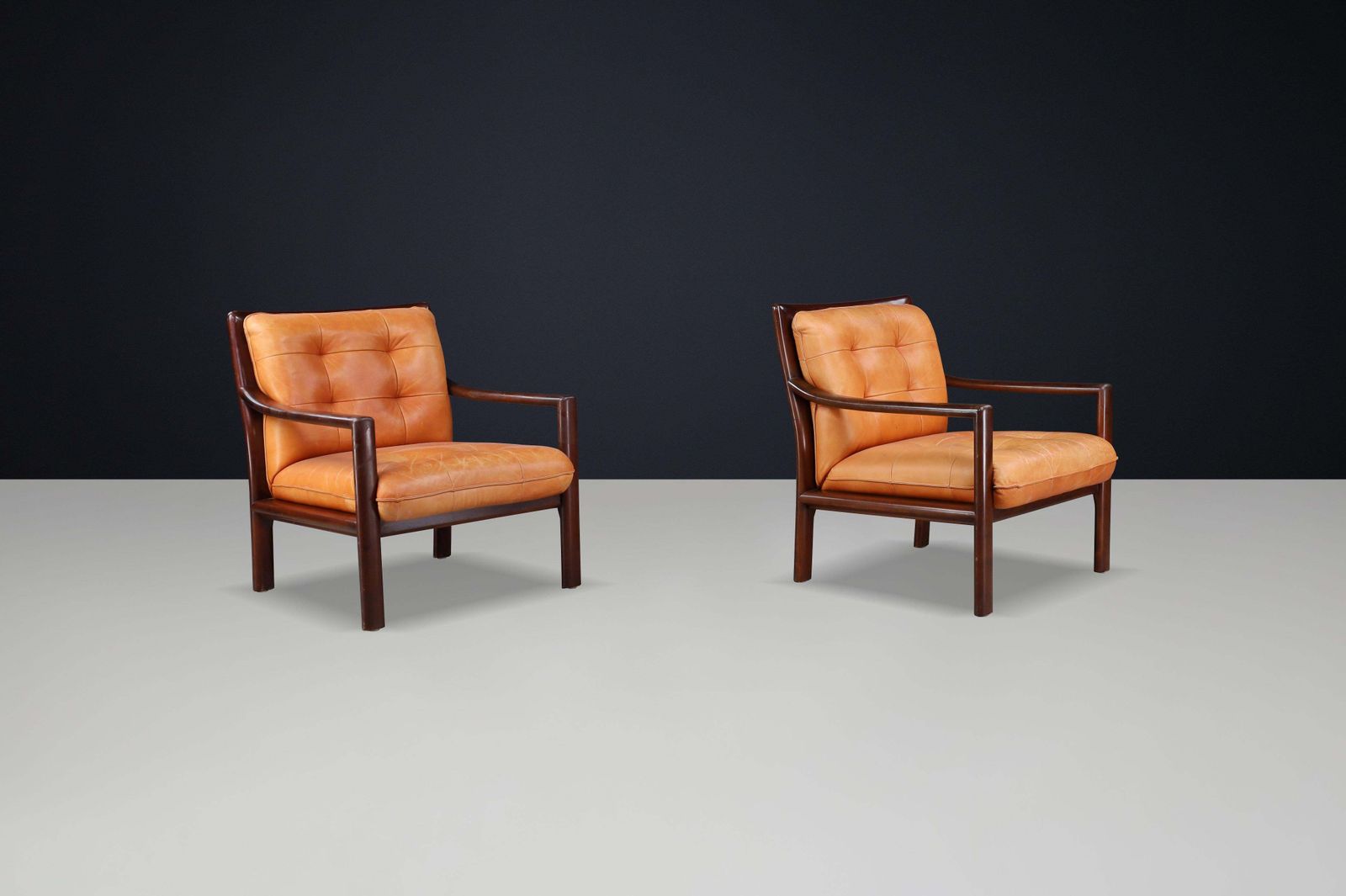 Pair Of Mid Century Lounge Chairs In Cognac Leather & Mahogany Stained Hardwood photo 7372.0