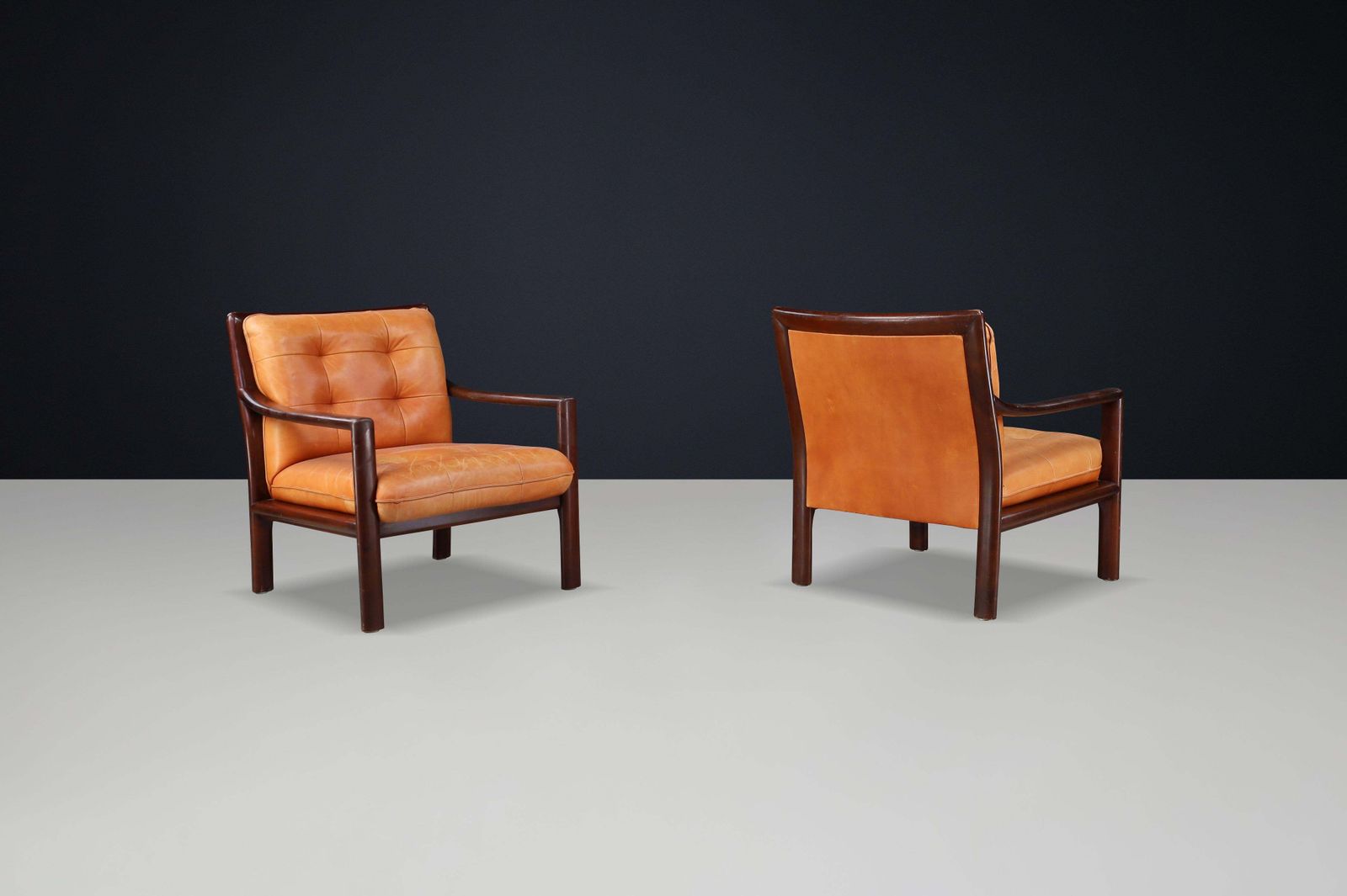 Pair Of Mid Century Lounge Chairs In Cognac Leather & Mahogany Stained Hardwood photo vinterior