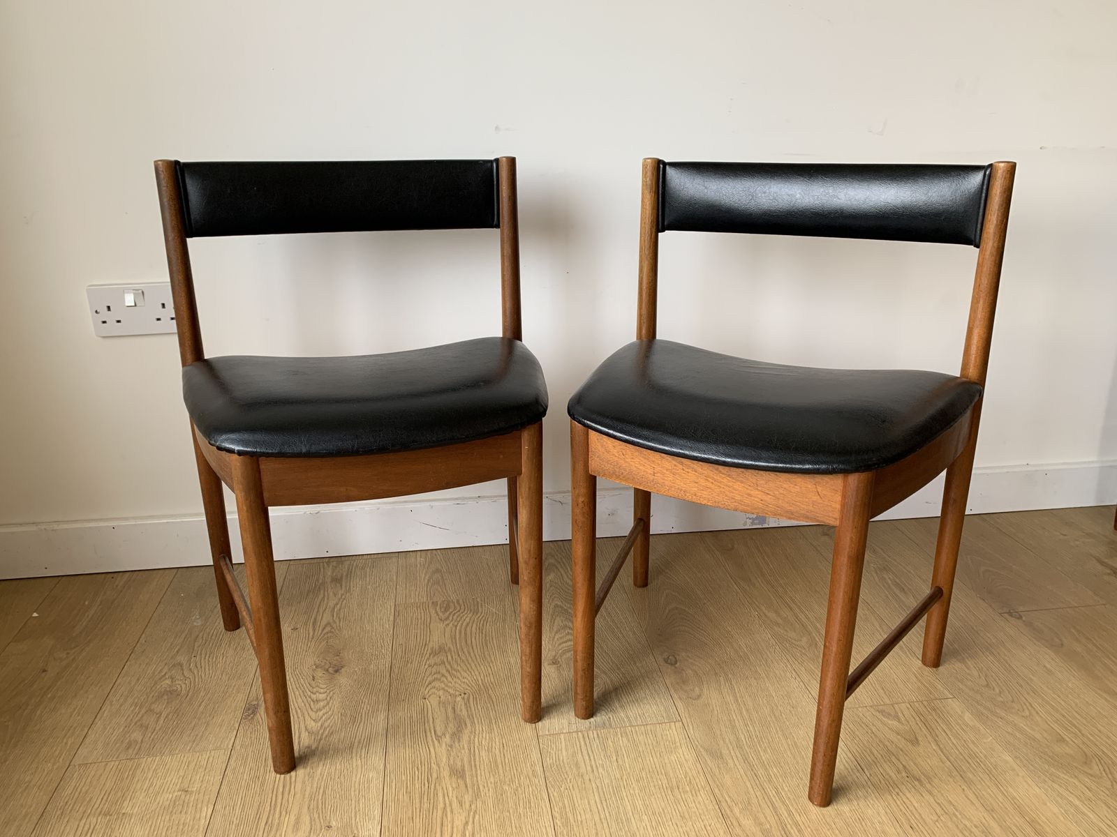 Pair Of McIntosh Space Saver Dining Chairs Covered In Original Black Vinyl (Model 9893)