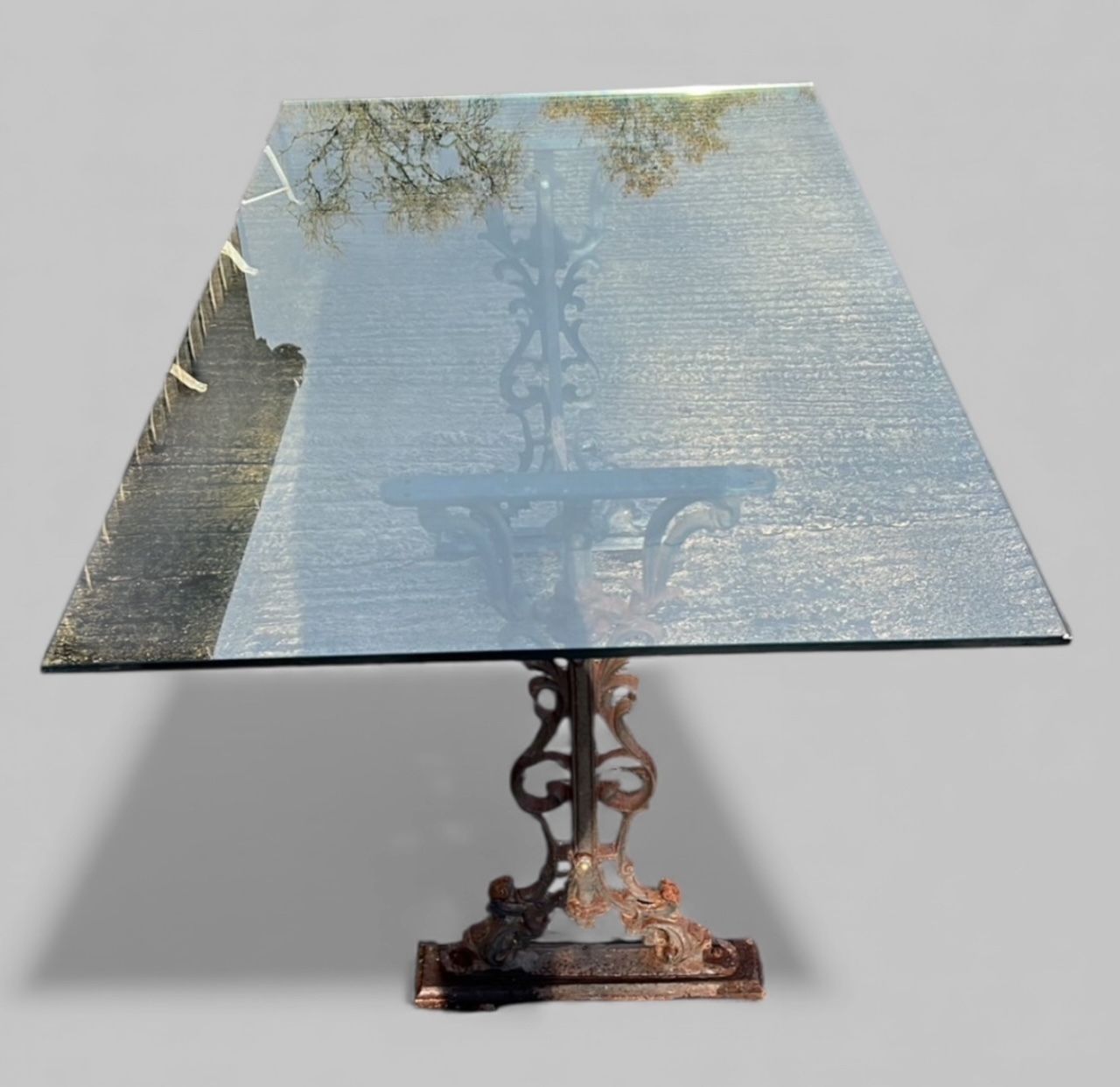 A Striking Antique Cast Iron Dining Table With A Modern Glass Top