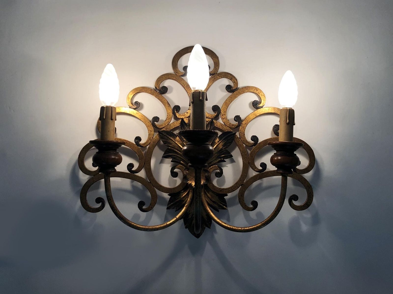 Large Pair Of Italian Three Light Wall Sconces In Gilt Wrought Iron. 1950s photo furniture