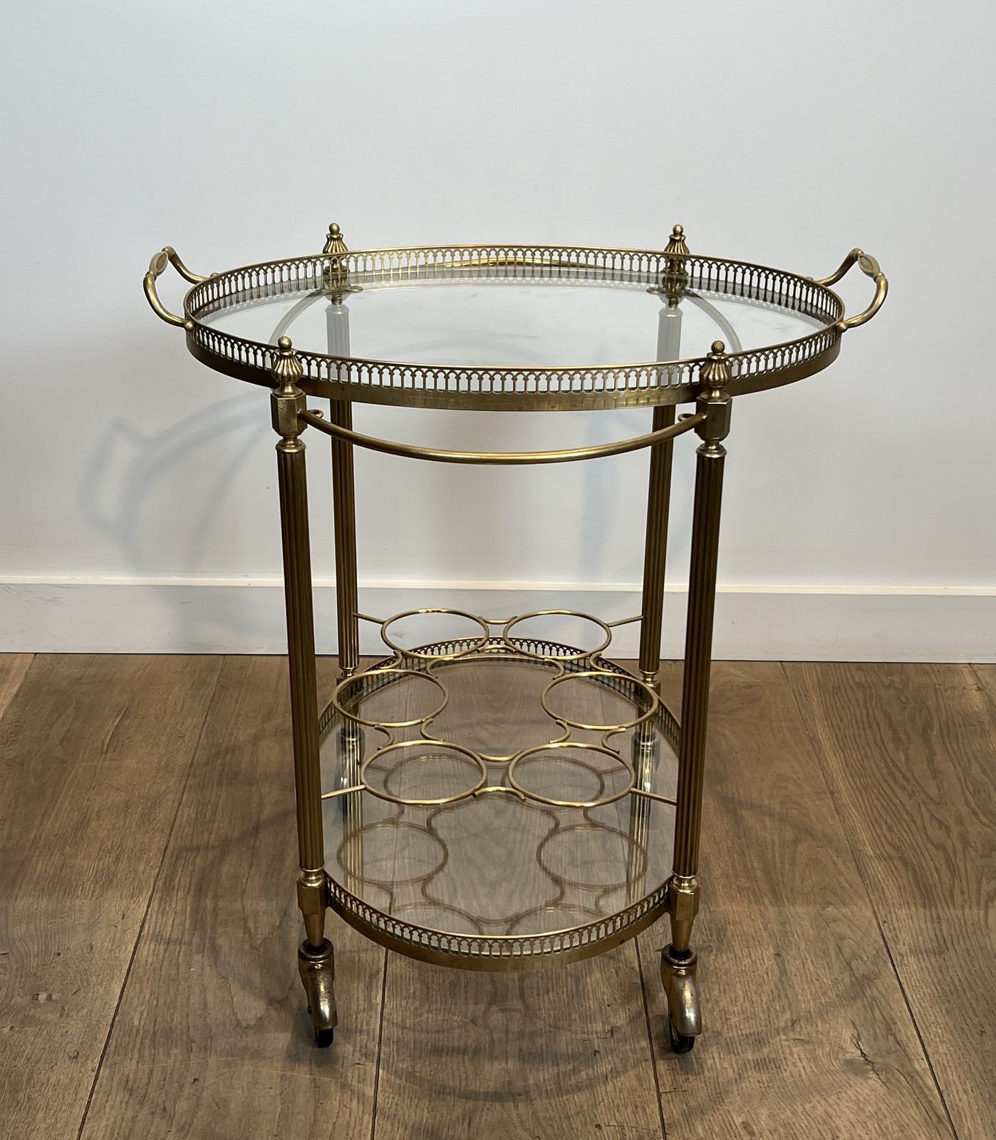 photo vintage Oval Brass Rolling Table In The Style Of Maison Jansen. Circa 1940
