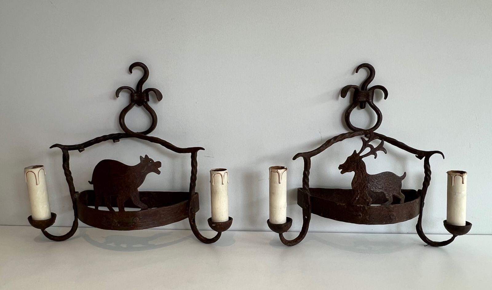 Pair Of Wrought Iron Wall Sconces Depicting Animals photo furniture
