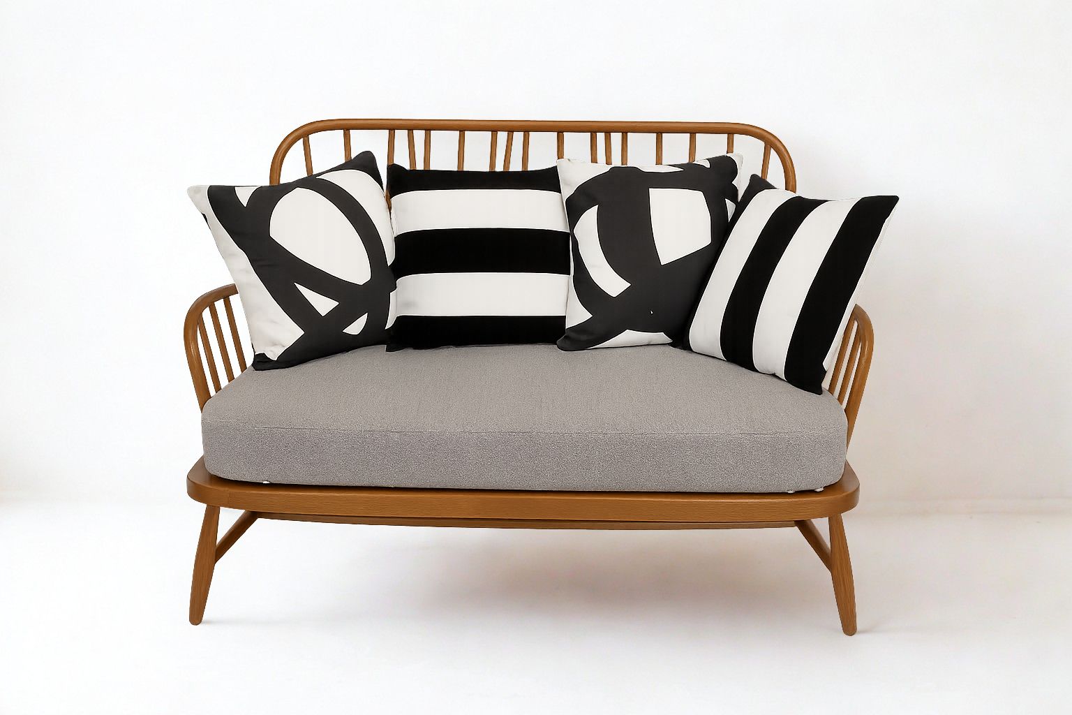 Ercol Jubilee 766/2 Two Seater Sofa With Grey Boucle Fabric And Monochrome Scatter Cushions
