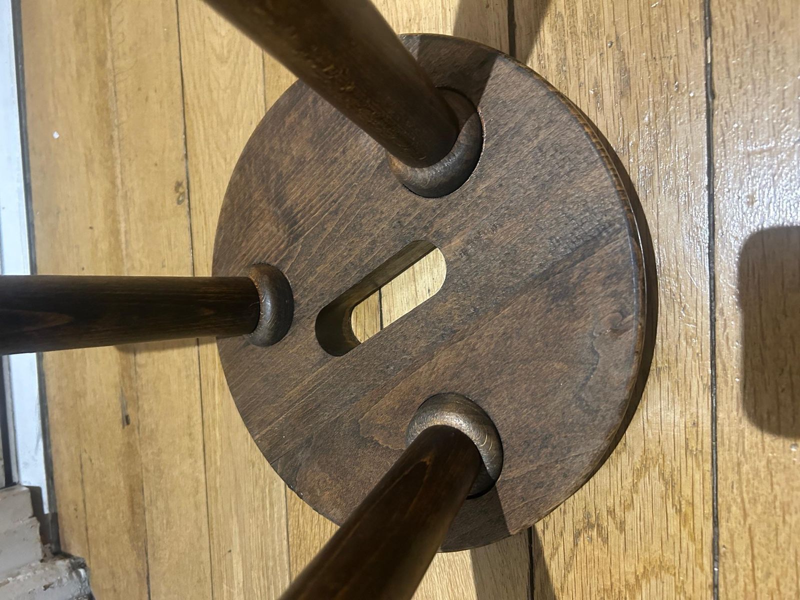 A Three Legged Wooden Stool With A Strong Brutalist photo buy