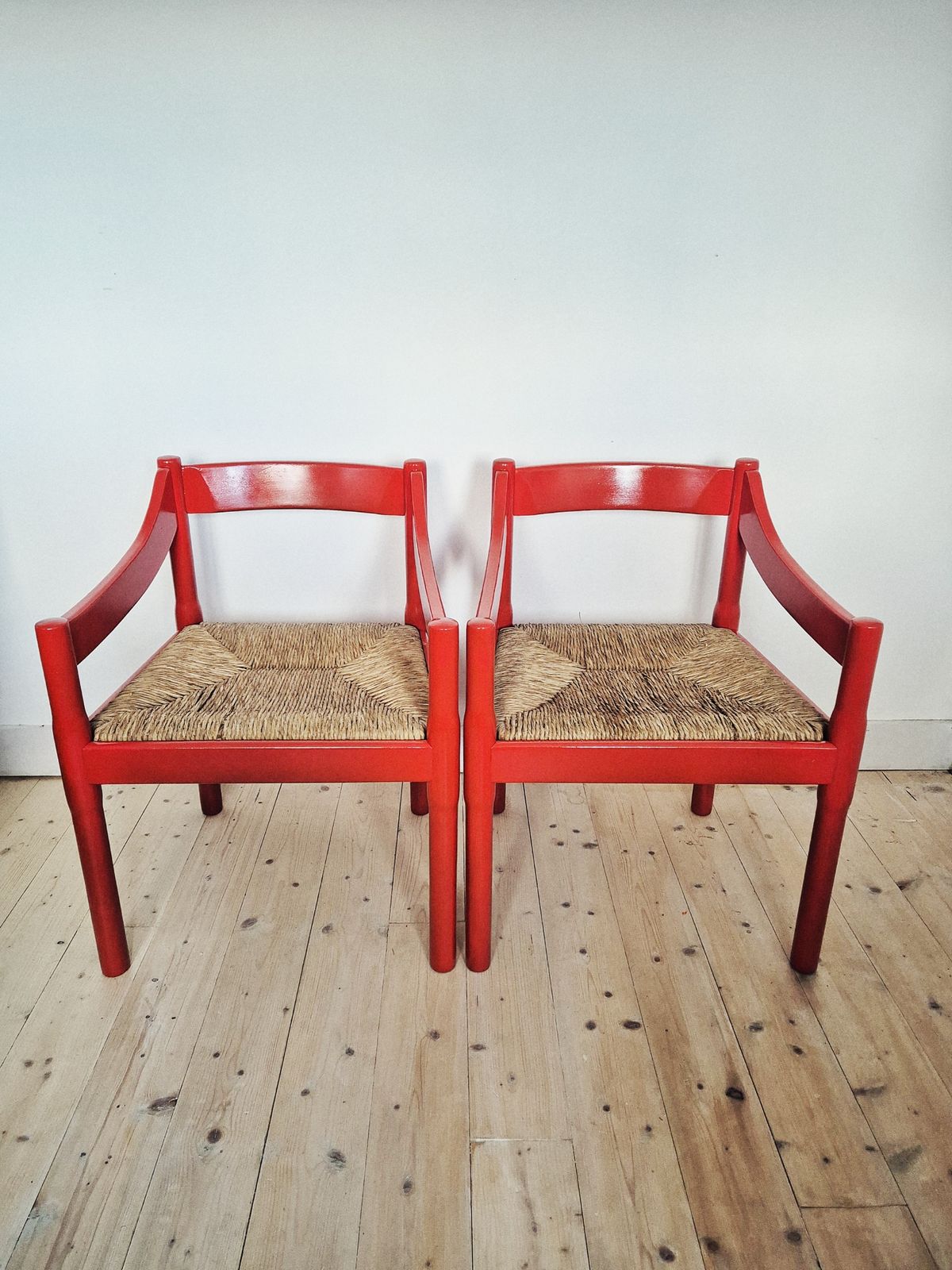 A Pair Of Red Vico Magistretti Carimate Carver Chairs photo furniture