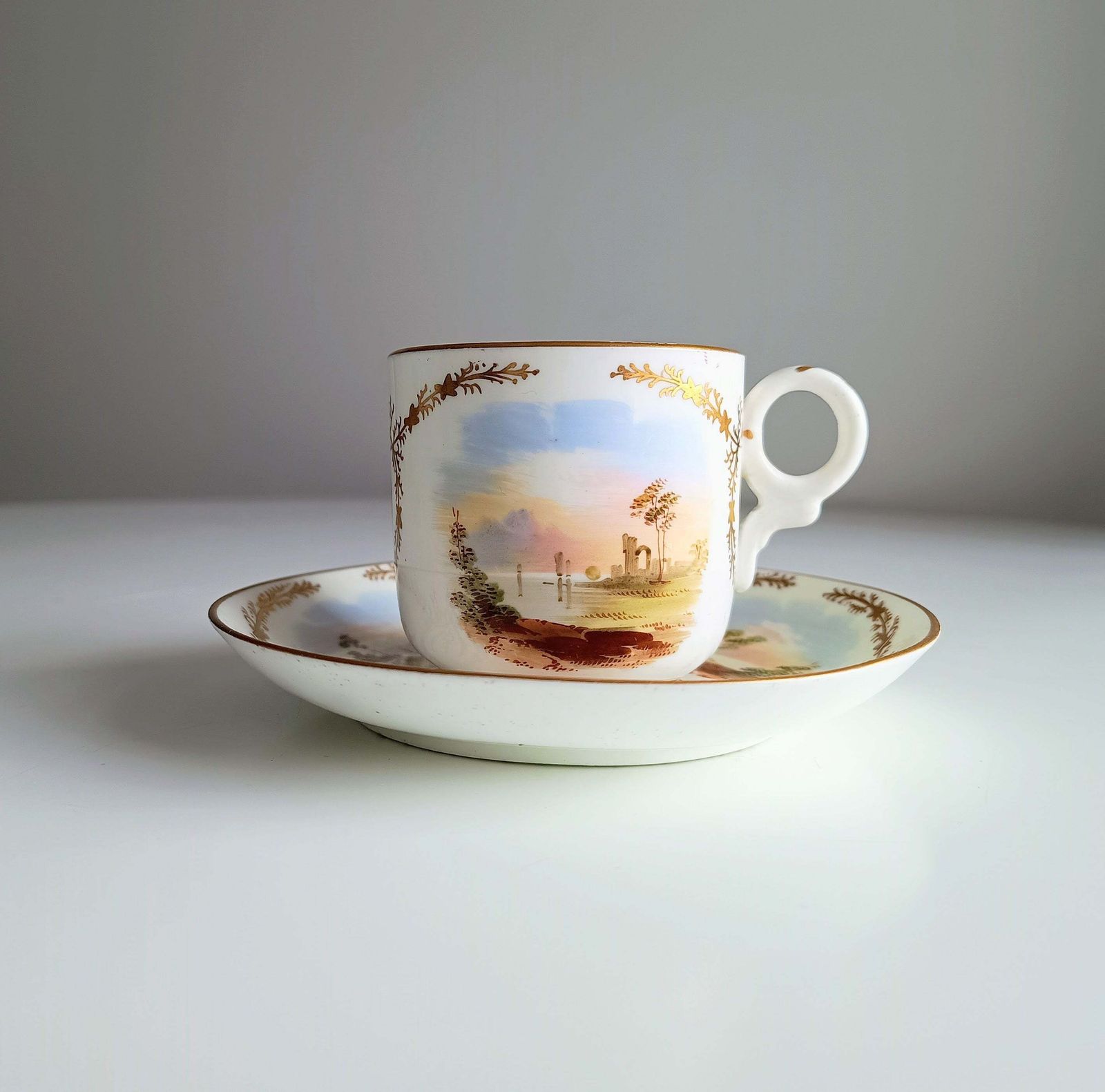 Antique Hand Painted Landscape And Gilt Crests Porcelain Cup & Saucer, Austria 19th Century