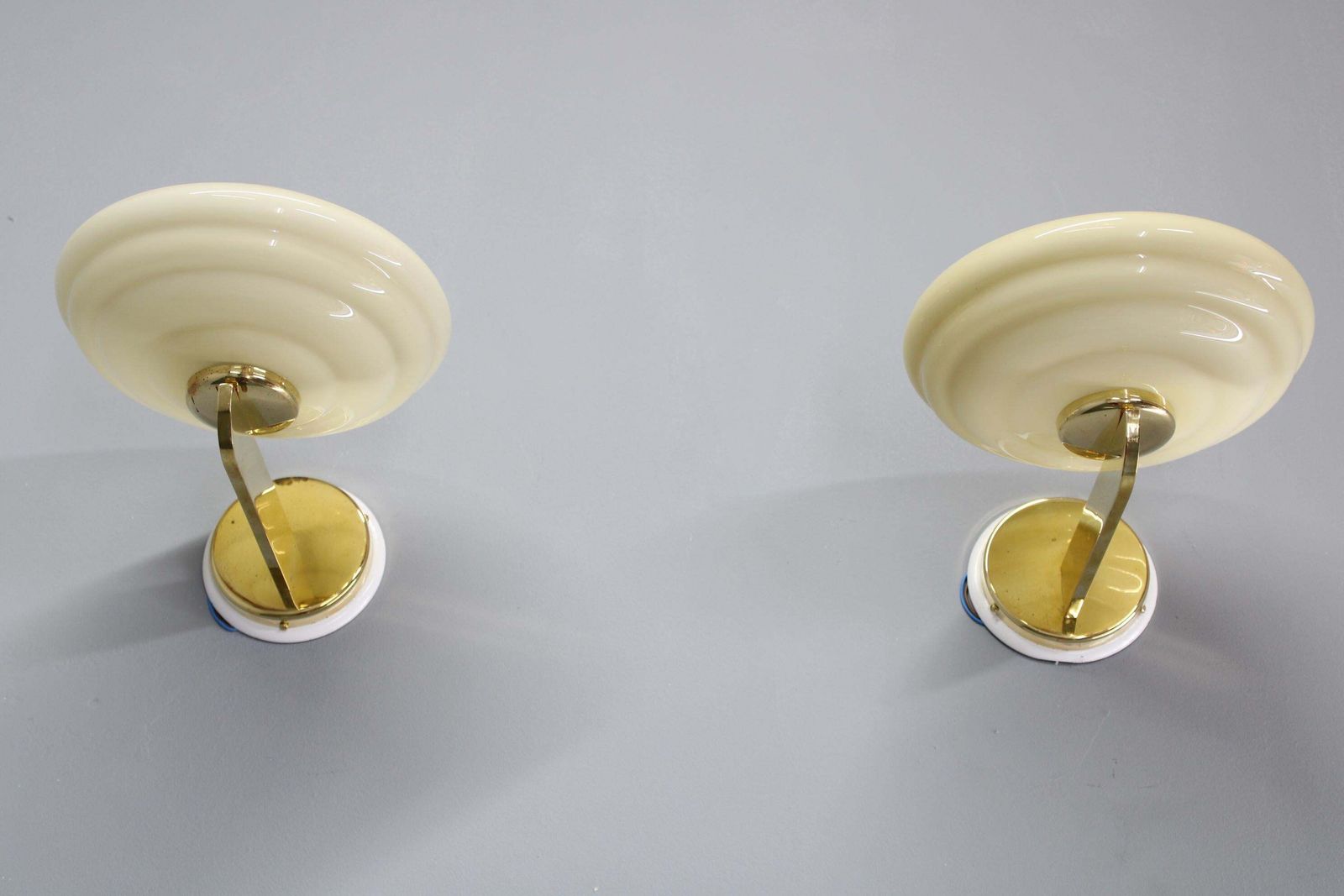 Pair Of 1940s Czechoslovak Art Deco Brass Wall Lights With Opaline Glass Shades photo for sale
