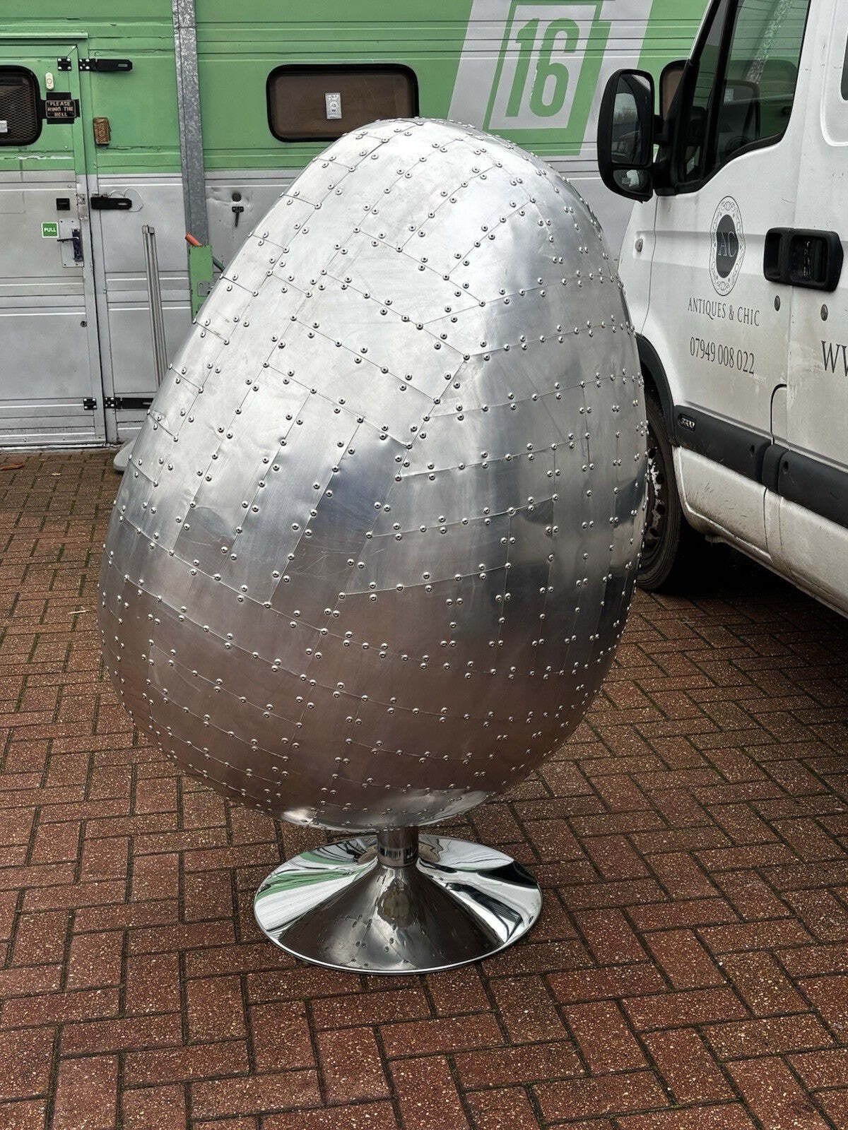 Aviation Swivel Egg Chair With Tan Leather. photo vinterior