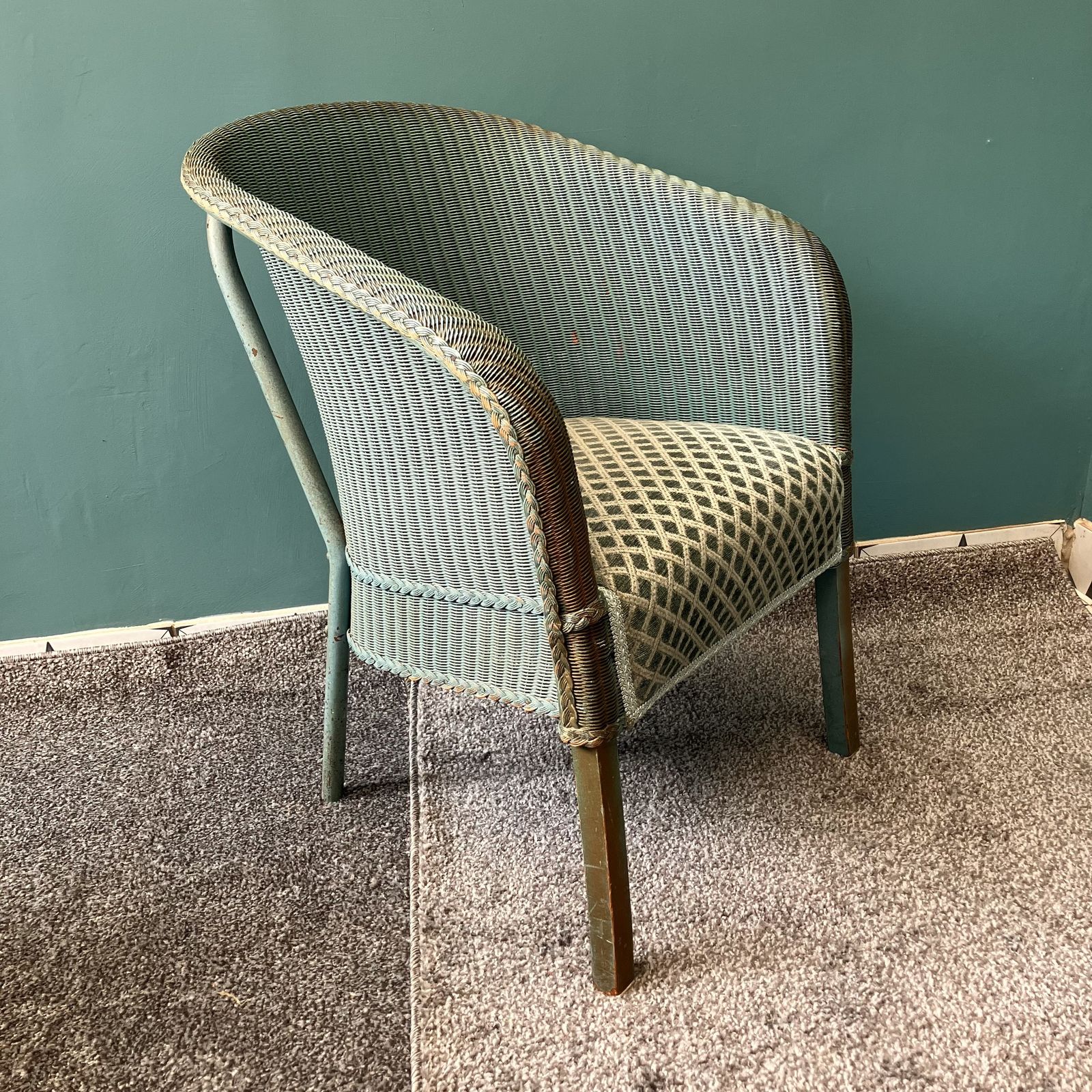 A Lloyd Loom Chair In Teal With Sprung Upholstered Seat