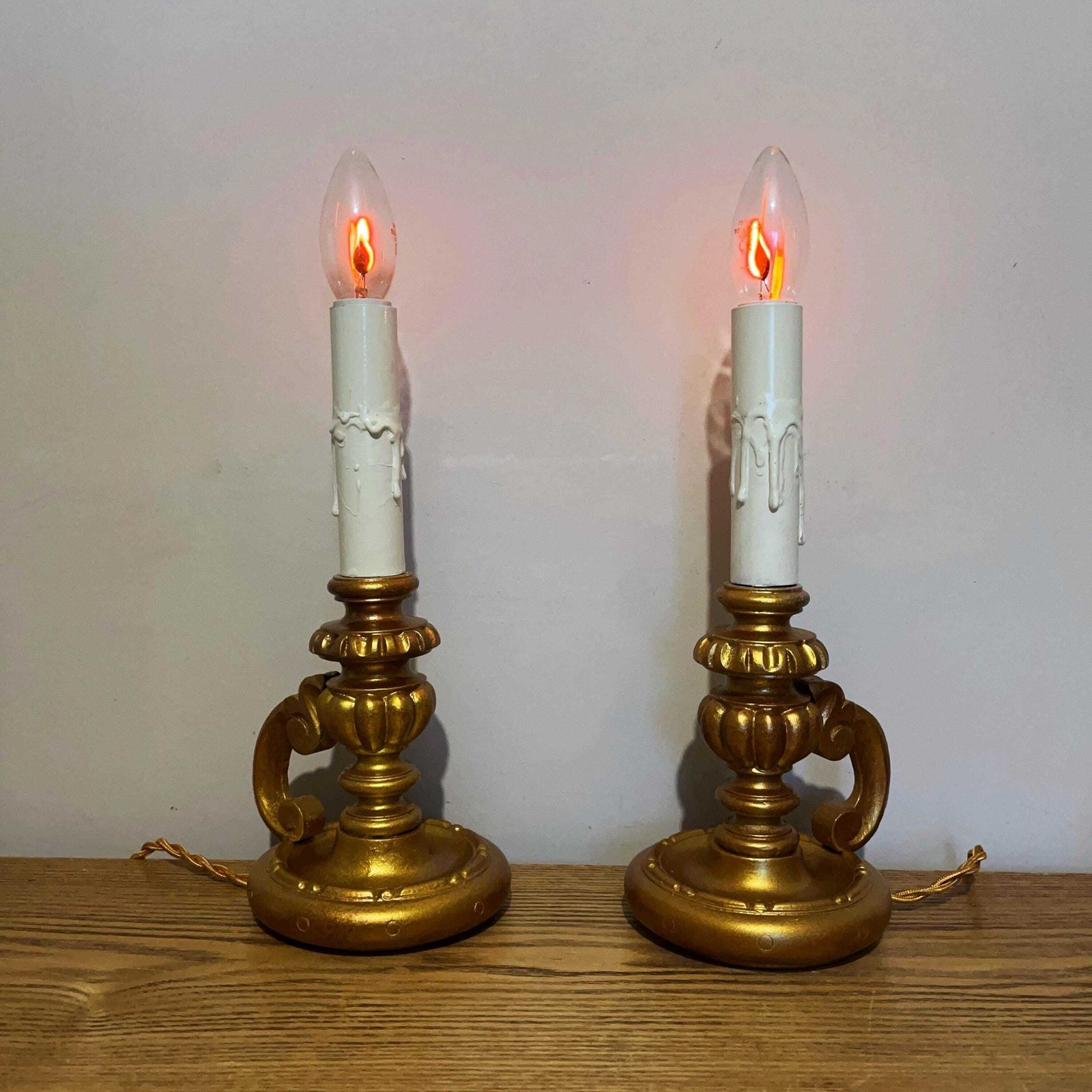 photo for sale Pair Of Gold Colour Vintage French Chateau Style Chamberstick Lamps.