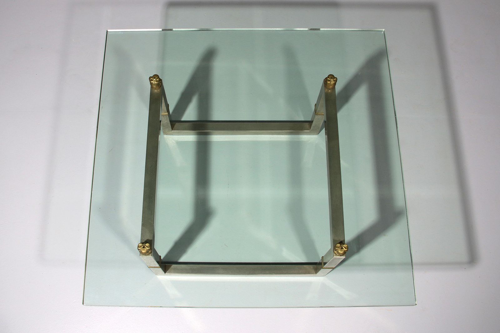 photo furniture Peter Ghyczy Glass Coffee Table With Stainless Steel Frame Biri T29