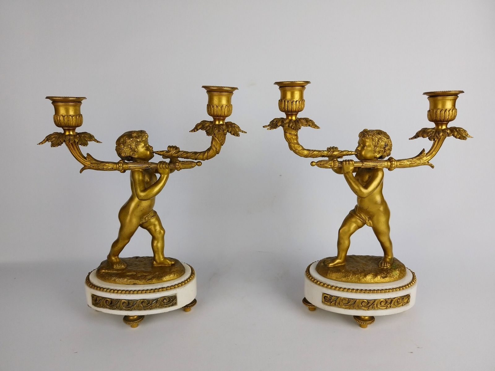 Pair Of Gilt Bronze Cherub Candlesticks photo furniture