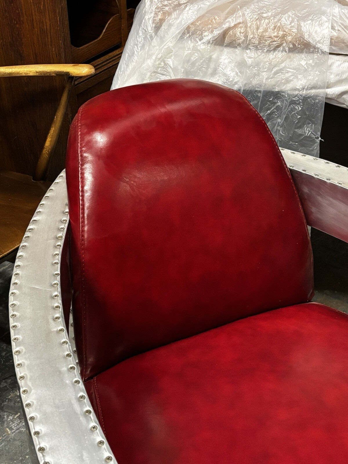 1311.0 Aviators Polished Metal Armchair, With Red Leather Upholstery. photo