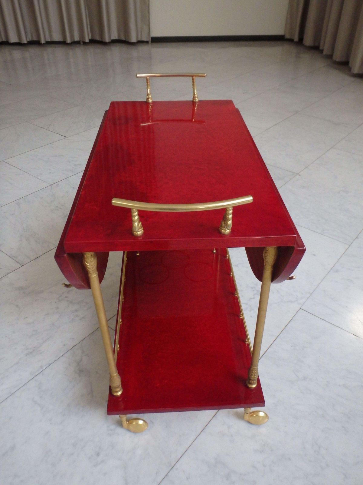 photo for sale Vibrant Red Coat Skin Bar Cart By Aldo Tura With Wings To Be Opend