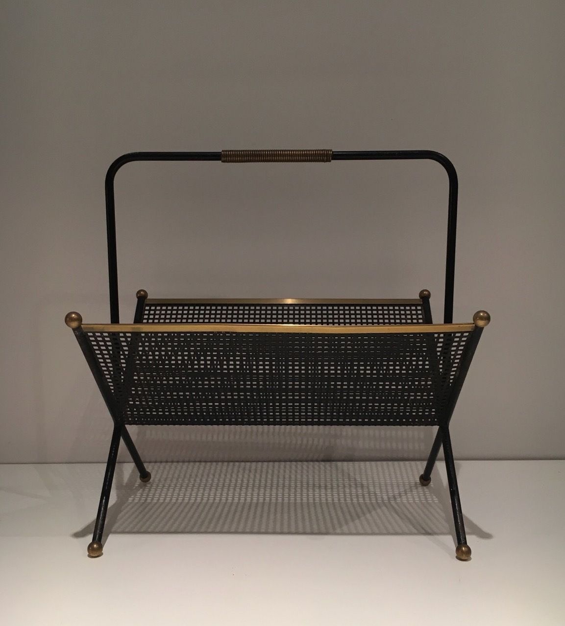 photo for sale Design Magazine Rack In Black Lacquered Metal, Perforated Sheet Metal And Brass
